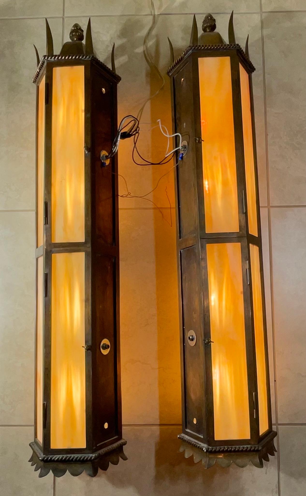 Illuminate your home with the timeless elegance of this exceptional pair of vintage hammered copper lanterns. These are not just lights; they're pieces of history, each whispering tales of a bygone era. Crafted from genuine, hand-hammered copper,