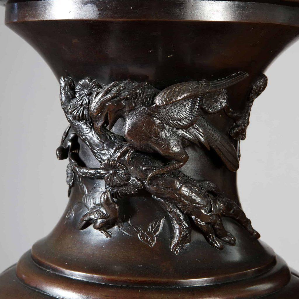 A pair of large Japanese Bronze vases dating from the Meiji period. Of baluster form with raised panels of birds among tree branches foliage and flowers, the main body of the vases with six unique and matching scenes.
Japan 1880

Measures: Height