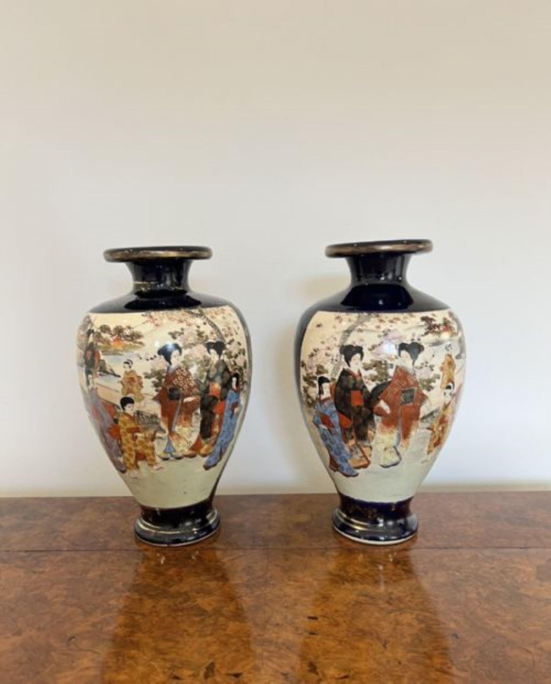 Large pair of antique quality Japanese satsuma vases having a quality pair of antique Japanese satsuma vases with wonderful hand painted decoration of figural and landscape scenes in blue, red, orange, black and gold colours. 
