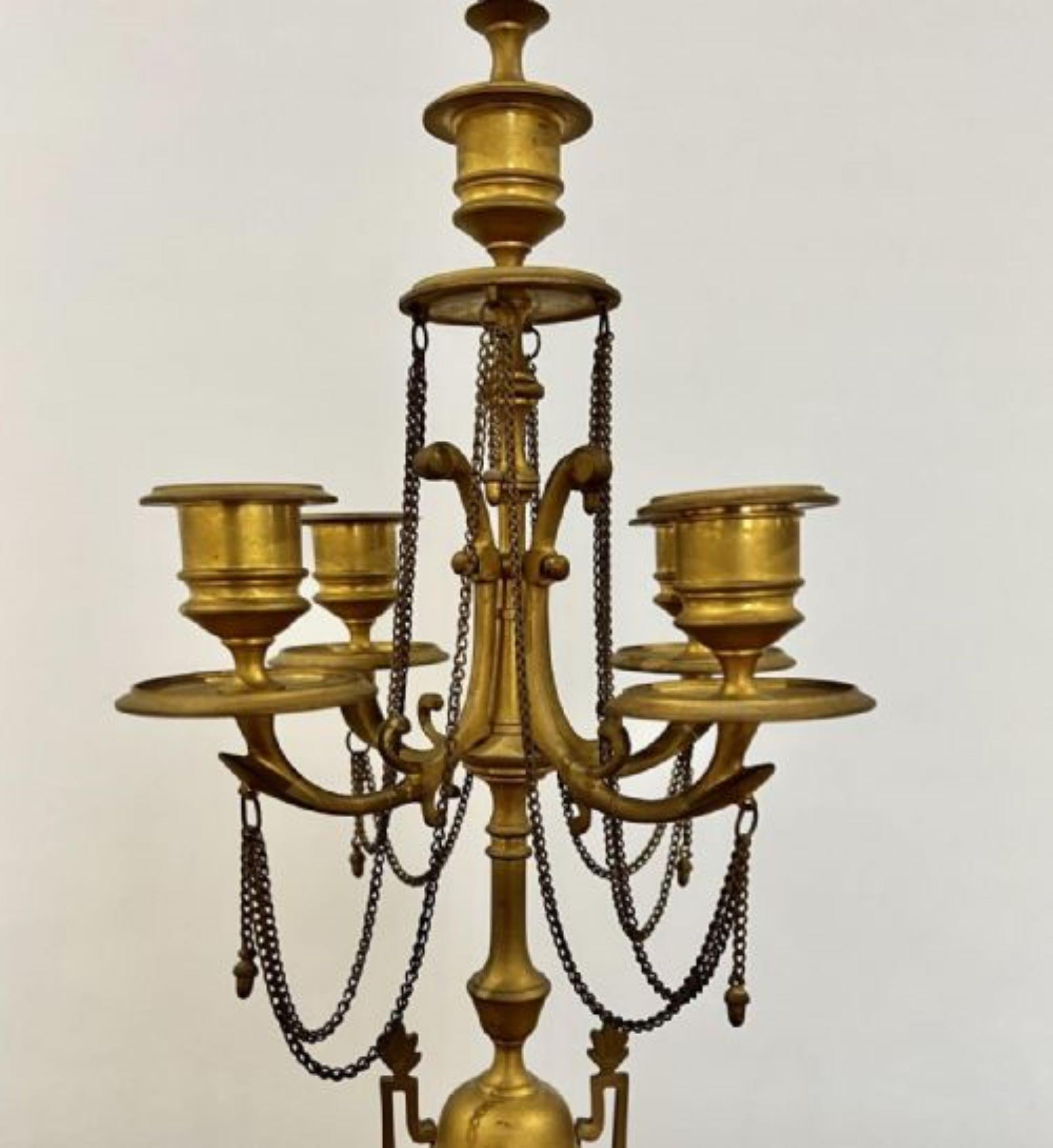 Large pair of mid 19th Century Victorian antique quality gilded brass candelabras having a quality pair of antique Victorian gilded brass candelabras with five candle lights, original drop chains supported on a turned brass column and standing on a