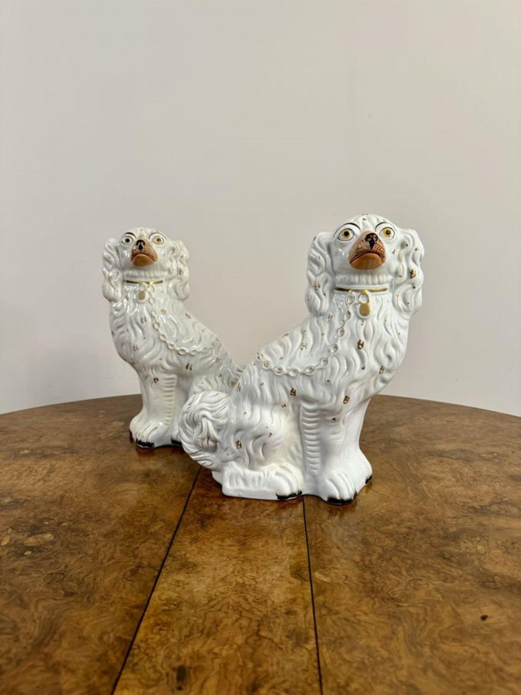Ceramic Large pair of antique Victorian seated Staffordshire spaniel dogs For Sale