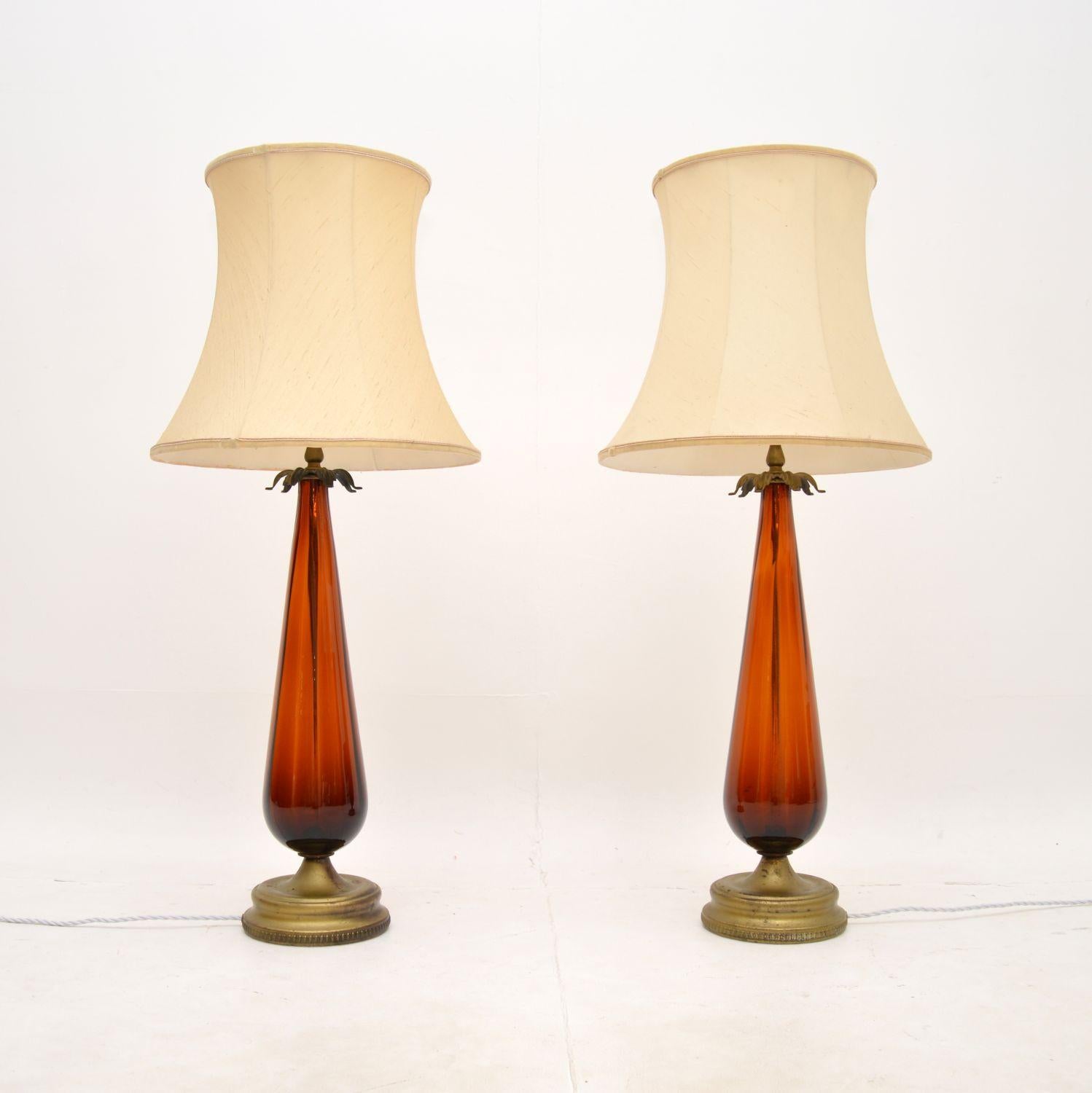 A stunning and very large pair of Art Deco glass table lamps. They were made in France, they date from around the 1920-30’s.

They are extremely impressive and are of very fine quality. They are designed in the image of aubergines, with gorgeous