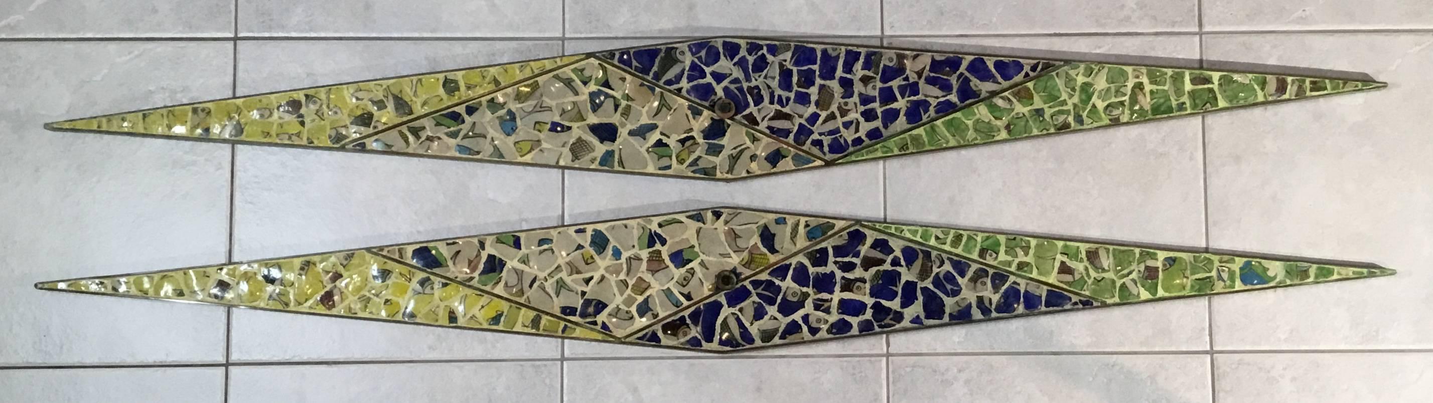 Beautiful pair of wall sconces made of brass, artistically hand embedded with old mosaic of Persian ceramic tiles. This one of a kind
Pair could be use as decorative wall hanging horizontal or vertical or if you like as wall sconces vertically with