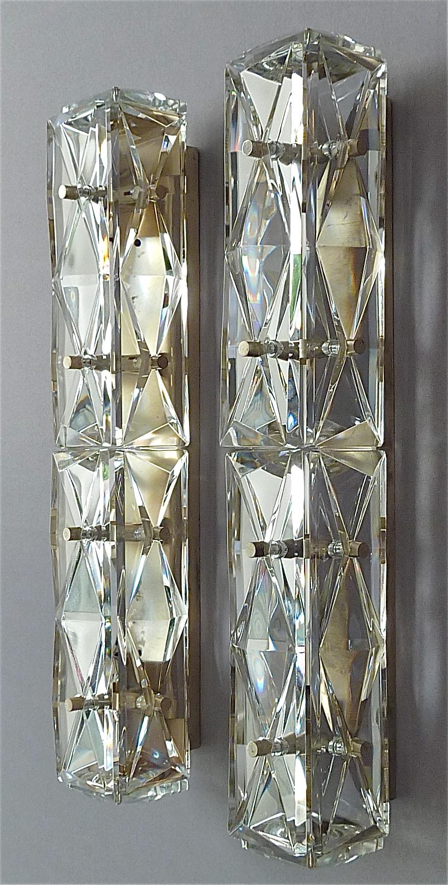 A large pair of faceted crystal glass silver plated wall lamps or vanity sconces manufactured by Bakalowits Austria or Kinkeldey Germany, circa 1970s. The high quality and luxurious lights comparable to Palwa and Lobmeyr, have each a silver plated