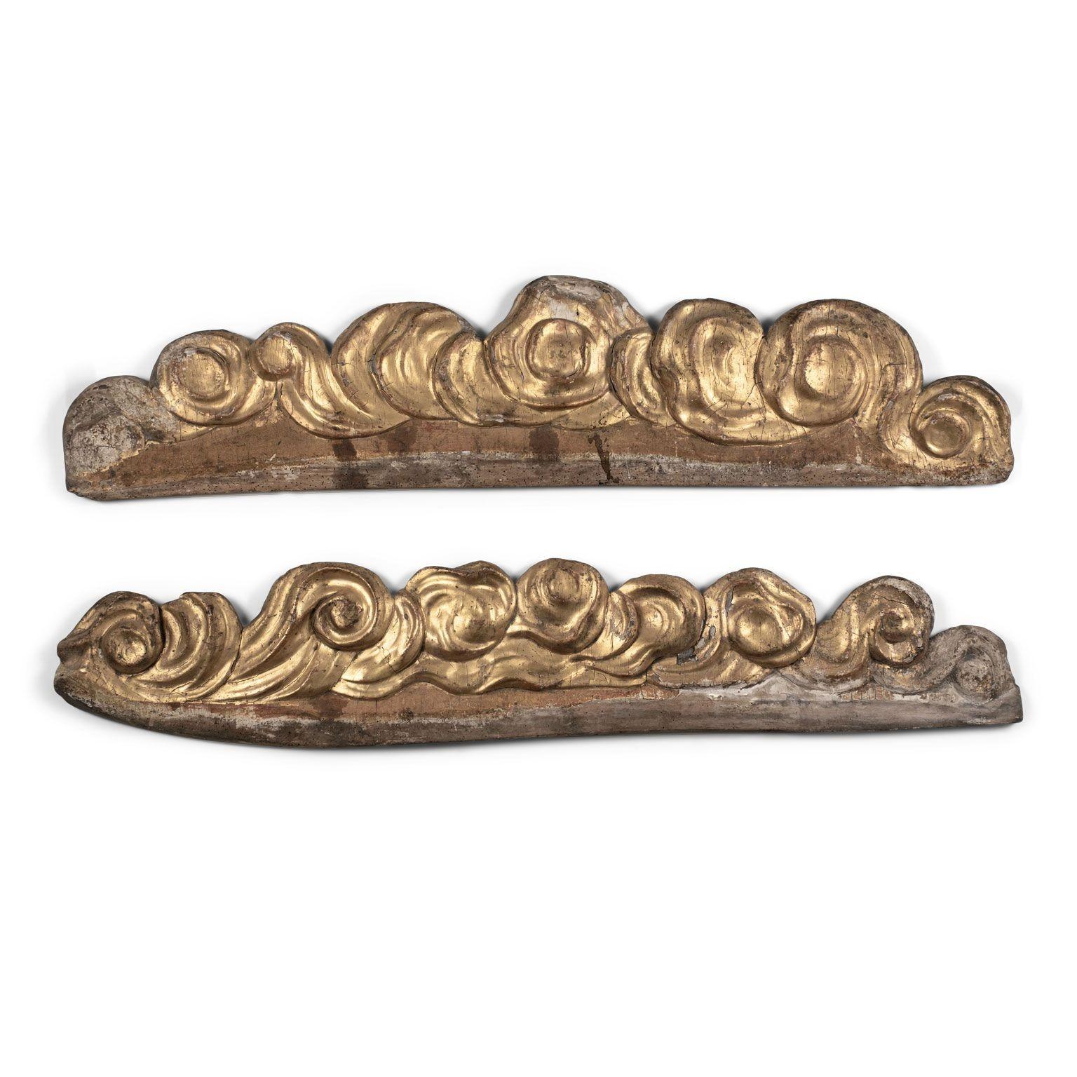 Large pair of baroque giltwood architectural fragments, hand-carved in giltwood circa 1710-1749. Original paint and gilding. Sold together and priced $5,400 pair.

They measure:
1. 11.5 inches high x 56 inches wide x 1.25 inches deep
2. 10.5 inches