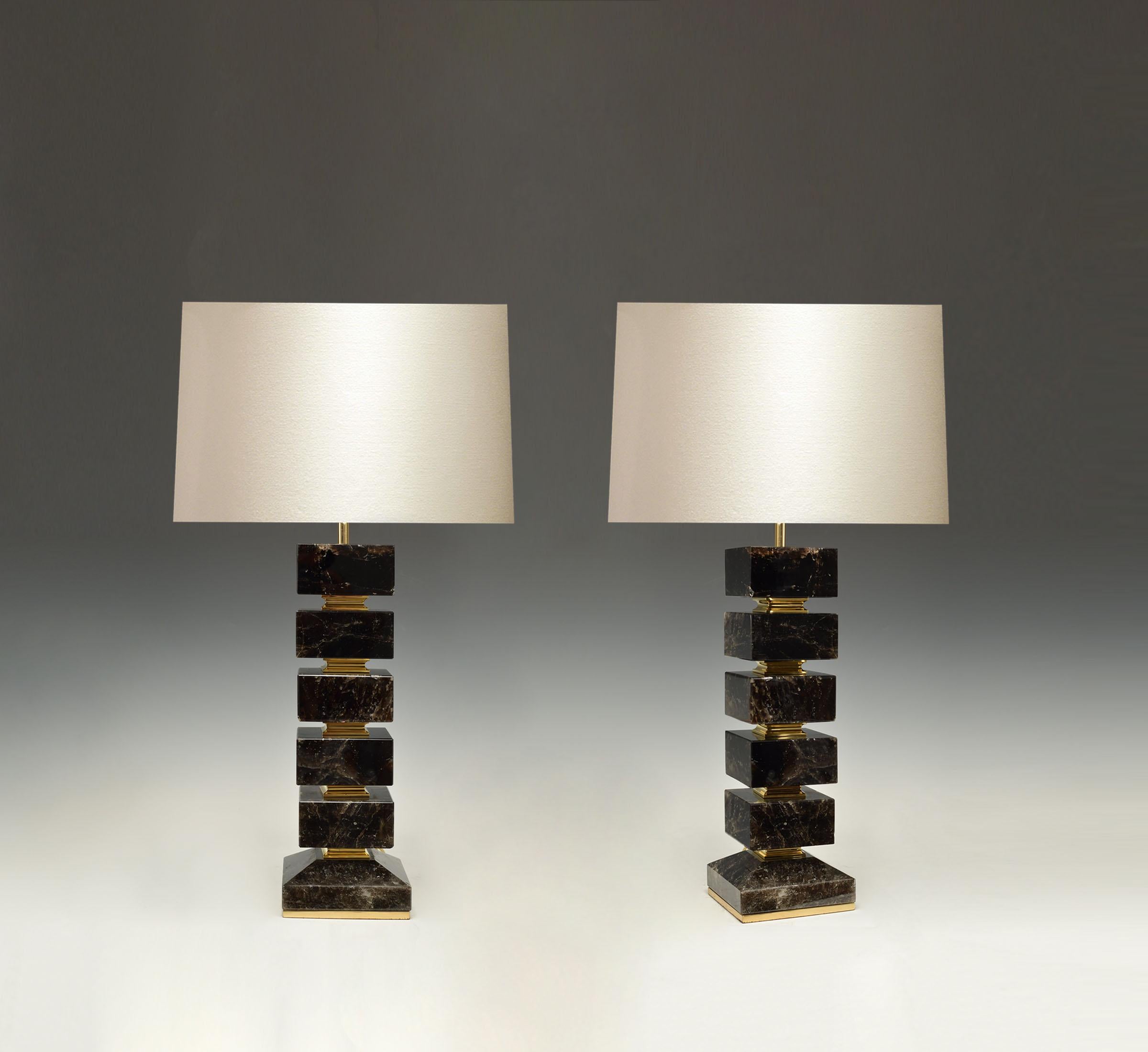 A large pair of block form dark rock crystal quartz lamps with polished brass bases. Created by Phoenix Gallery, NYC.
Available in nickel plating and antique brass finished. 
Each lamp installed with two sockets, 75 watts each socket, total of 150