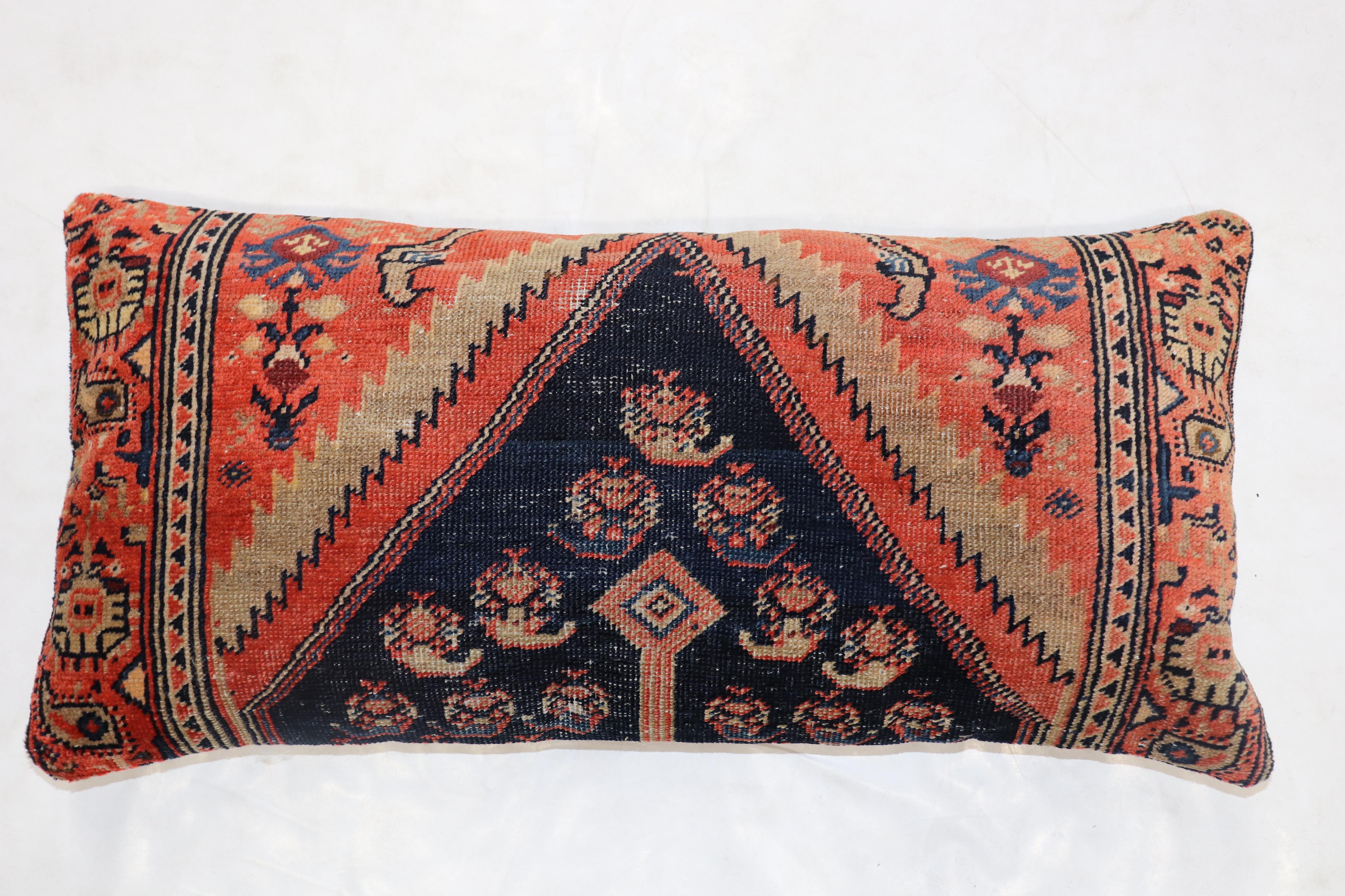 Set of large floor size pillows from an early 20th century Tribal Persian rug each measuring 15” x 32” and 15” x 31”.