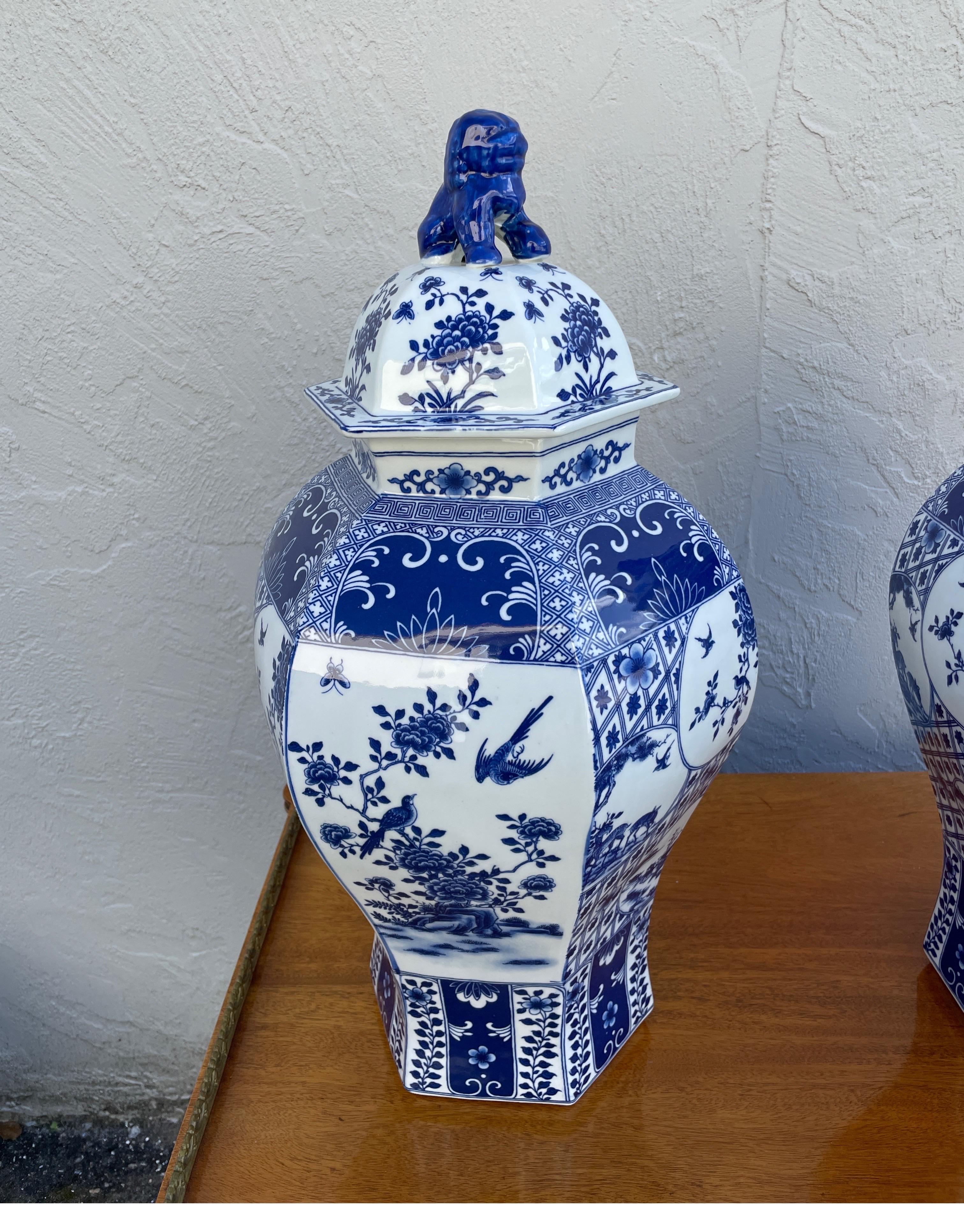Large pair of blue & white Chinoiserie Ginger jars with foo dog lids. Very nice detail throughout.
