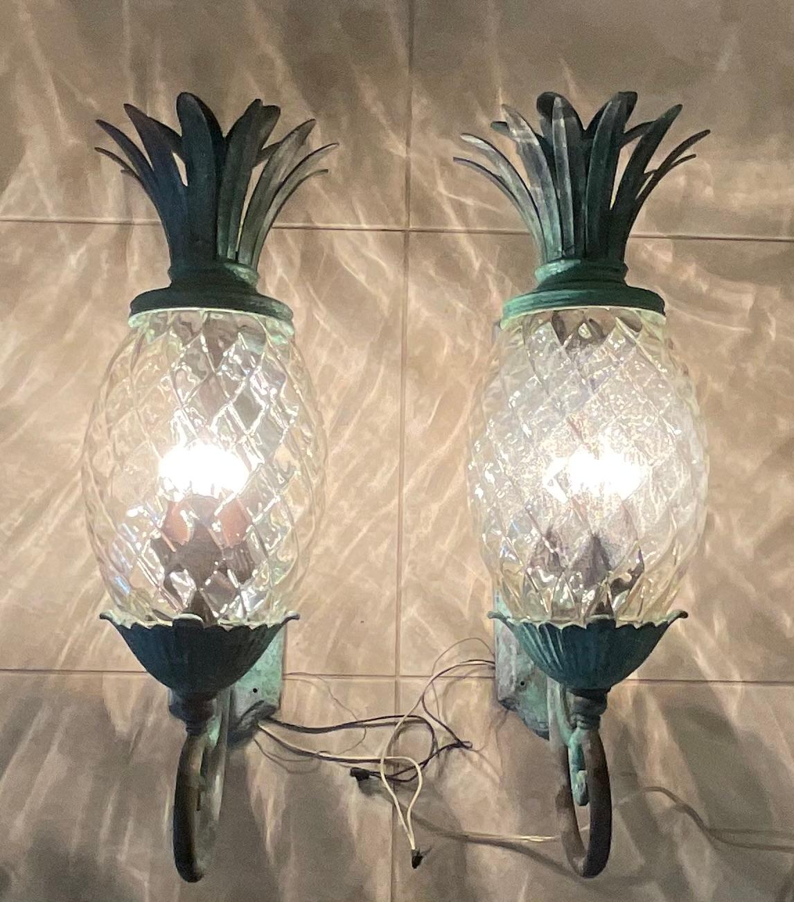 Beautiful pair of pineapple wall lights, made of bronze and solid brass with three 60/watt light each , great patina , decorative for indoor or outdoor.
Clear glass ,although one glass is slightly frosted ,see photos .
Ready you use .
