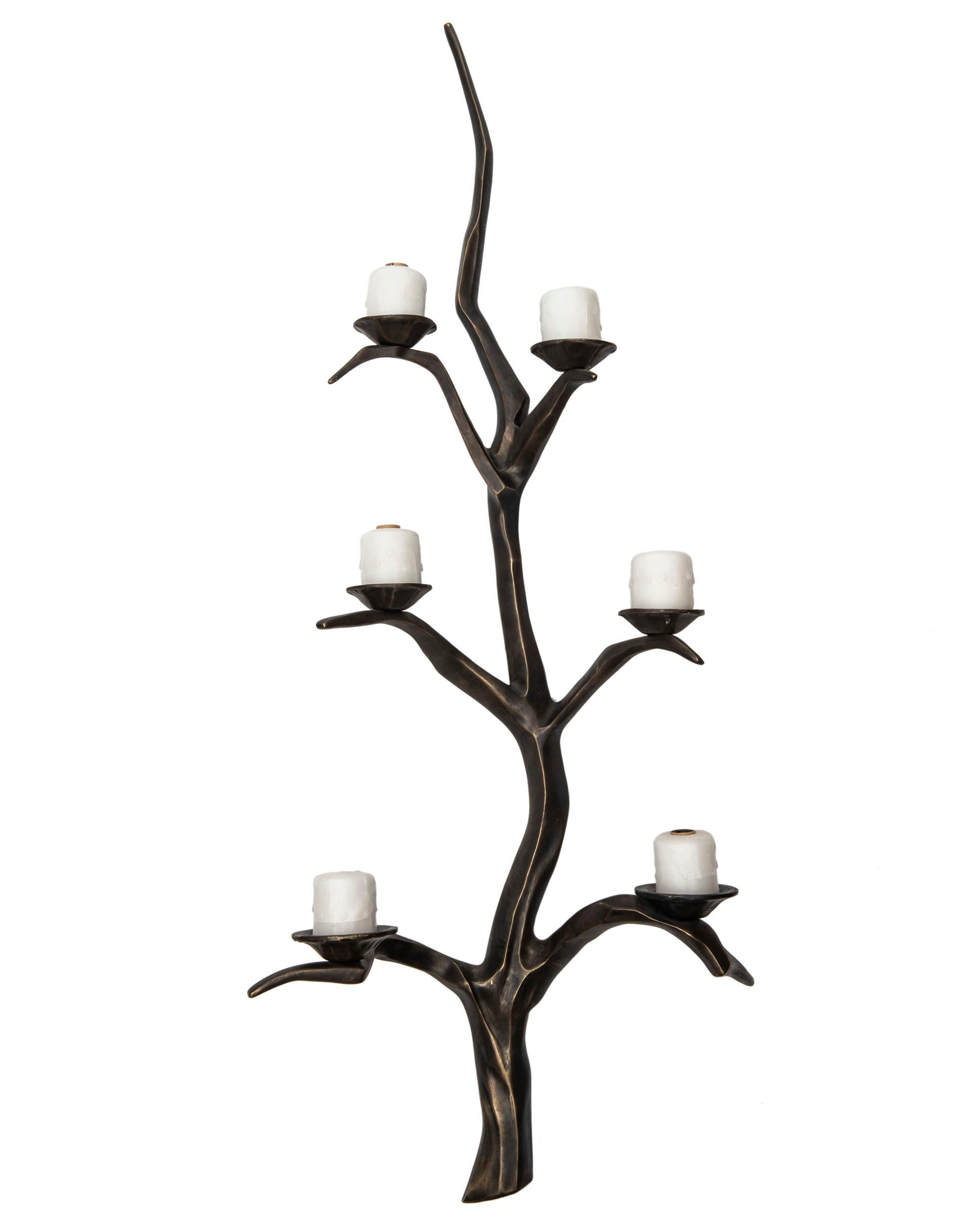 These are an amazing pair of six-light solid bronze wall sconces in a rich dark brown color with
hints of brass showing on the edges. The sconces are illuminated and decorated in a wax finish.