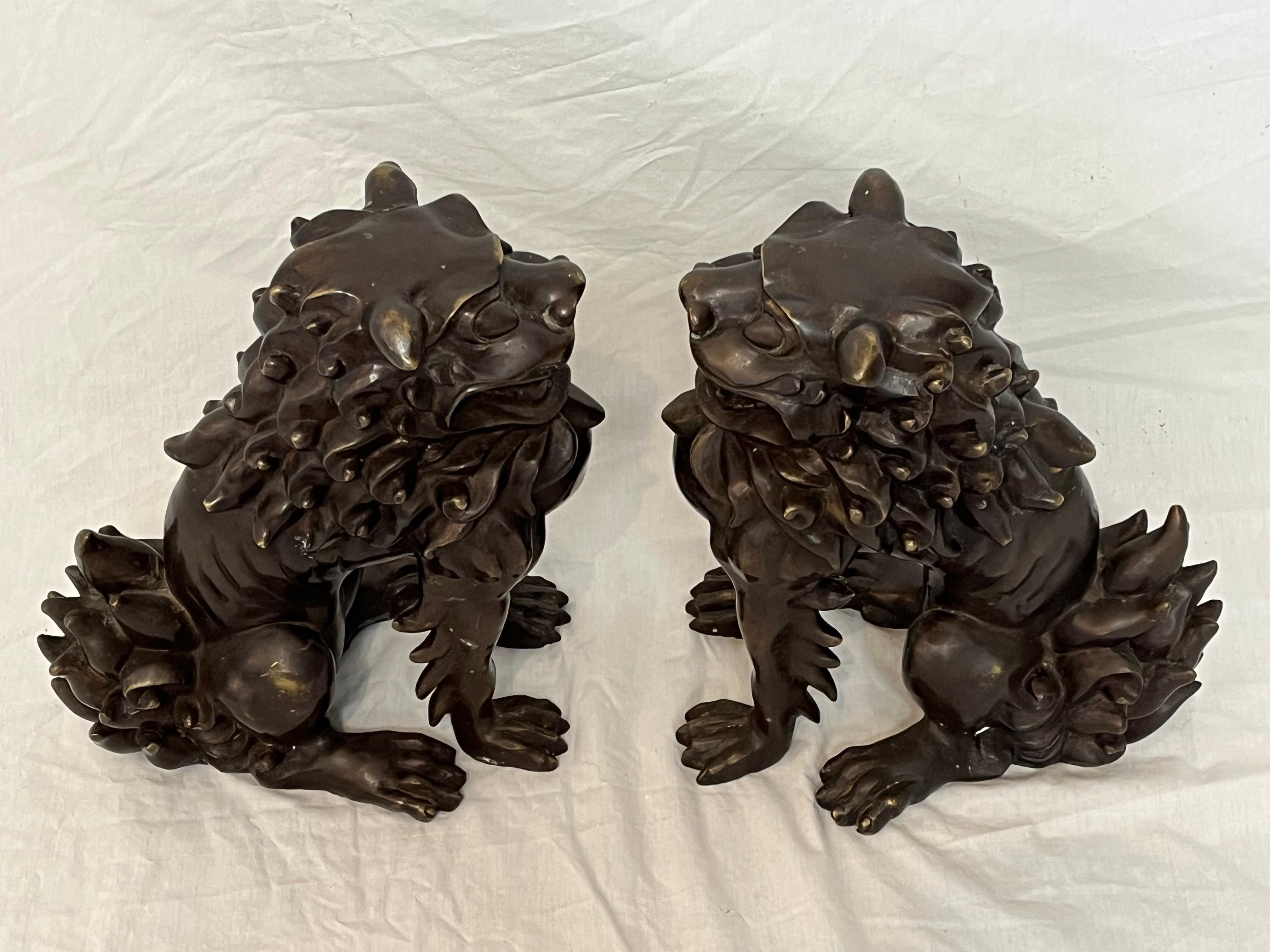 A large and impressive pair of bronze lionized Shih Tzus - also known as Fu (Foo) dogs. The pair each have wonderful detail, great scale and true heaviness and quality. The artistically tufted manes, the lean bodies, the rich and warm patina - these