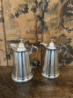 Large pair of Carrington of Regency silverplate pots, pitchers