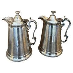 Large pair of Carrington of Regency silverplate pots, pitchers