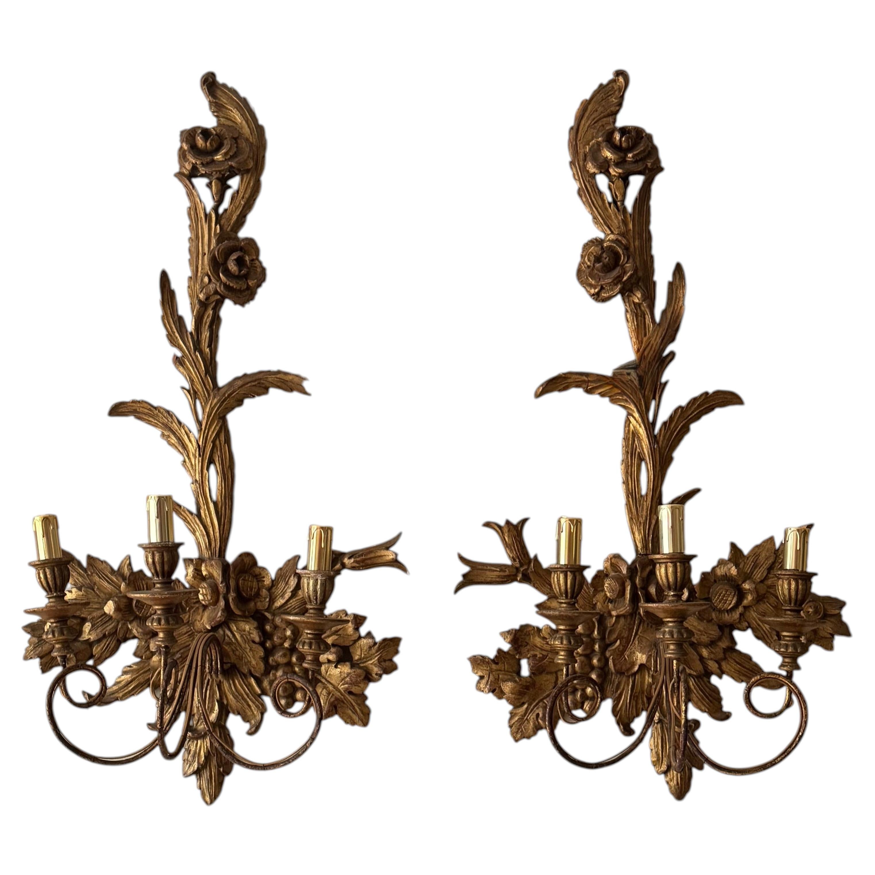 Large pair of carved and gilded Baroque style wall lights