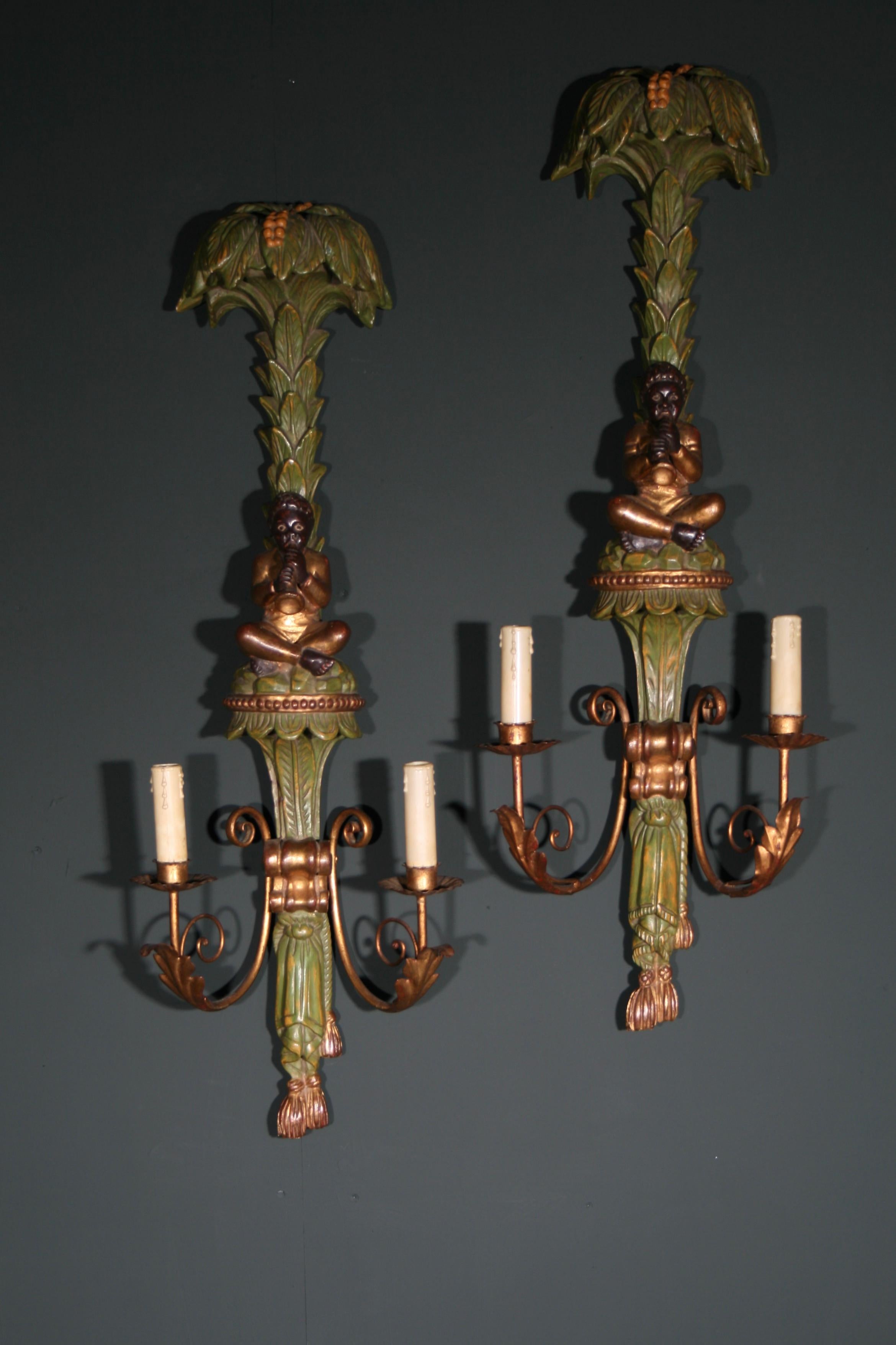 A Large Pair of Carved Wood Wall sconces/Lamps. Fully wired and in original condition.  They can be used either with lamp bulbs or candles.

Wiring is original 

Original paint throughout.