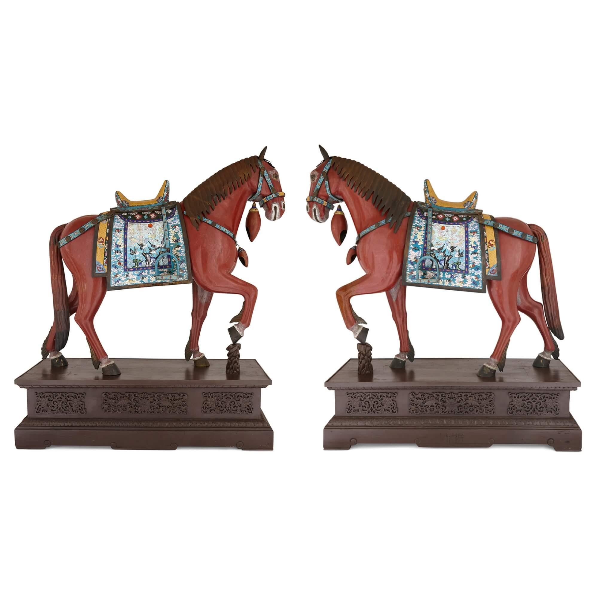 Large pair of Chinese cloisonné enamel horse sculptures 
Chinese, Early 20th Century
Horses: Height 159cm, width 185cm, depth 71cm
Bases: Height 48cm, width 174cm, depth 69cm 
Both: Height 207cm, width 185cm, depth 71cm

Executed in cloisonné