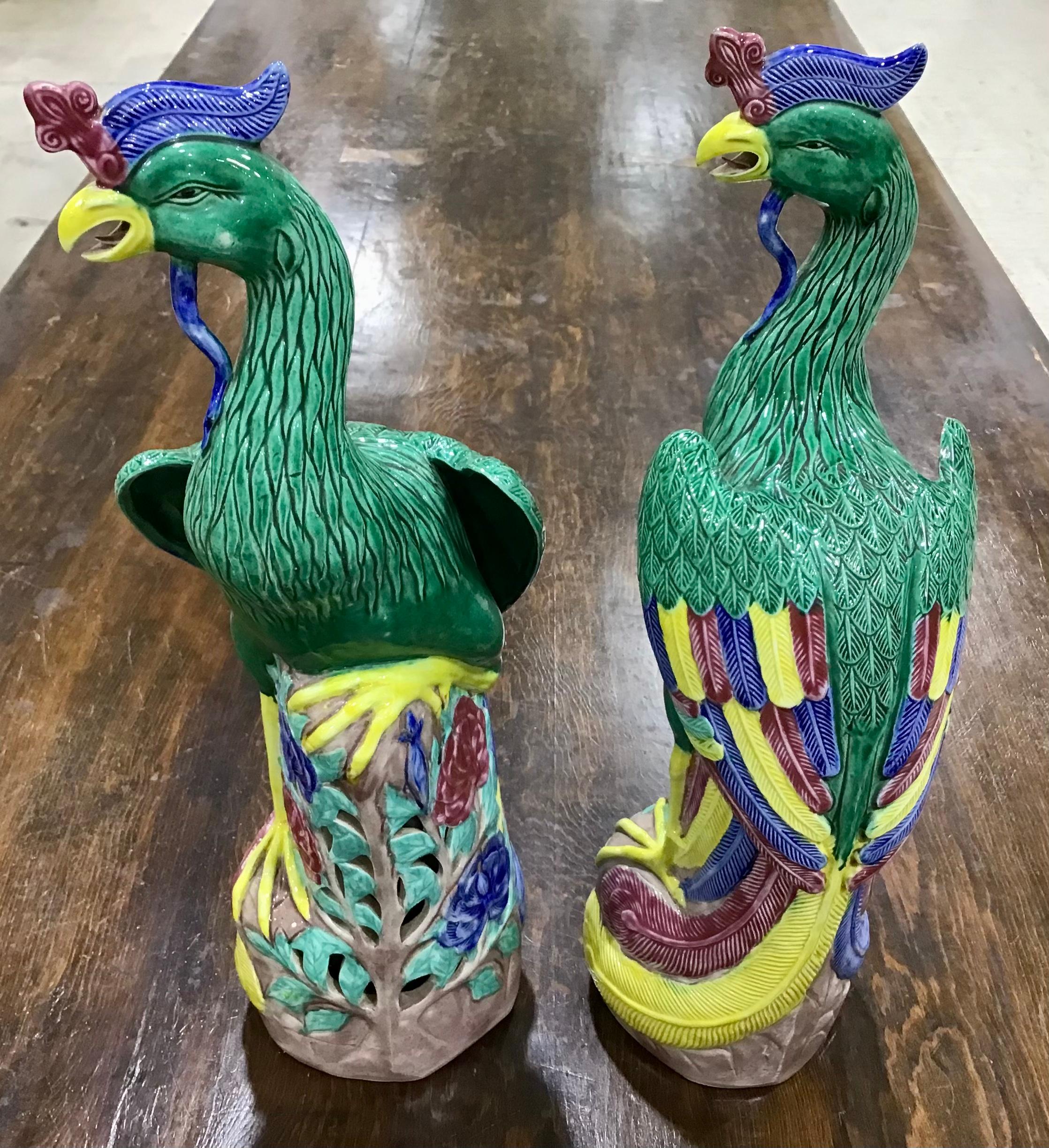 A wonderful pair of porcelain Chinese export models of roosters. A mirror-image pair of finely modeled porcelain roosters in polychrome glaze; each with great detail seen in their heads, eyes, combs and wattles; their finely-painted feathers in a