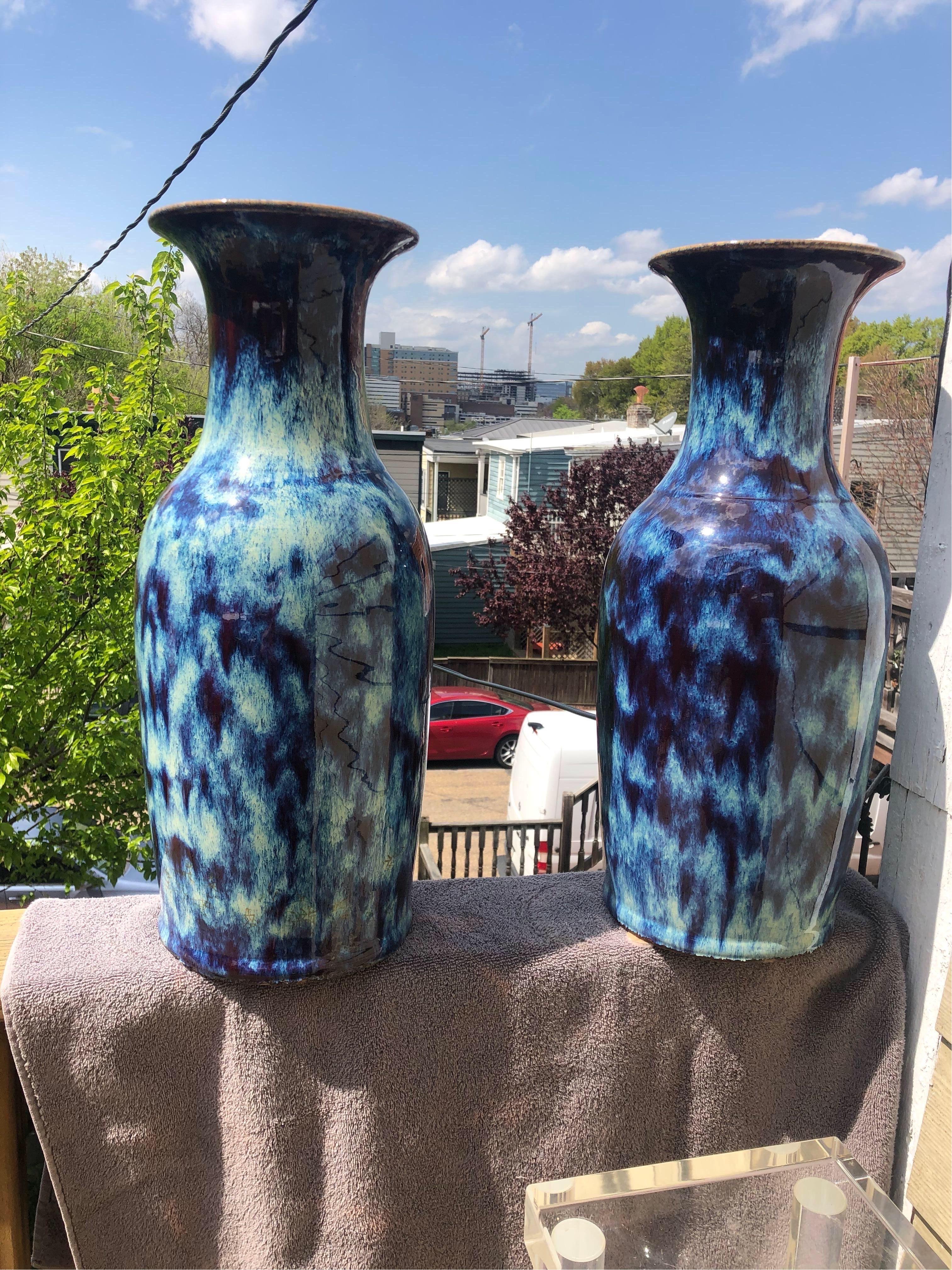 Large pair of Chinese flambé glazed porcelain baluster vases, overall mottled blue and cream streaked copper red glaze.
 