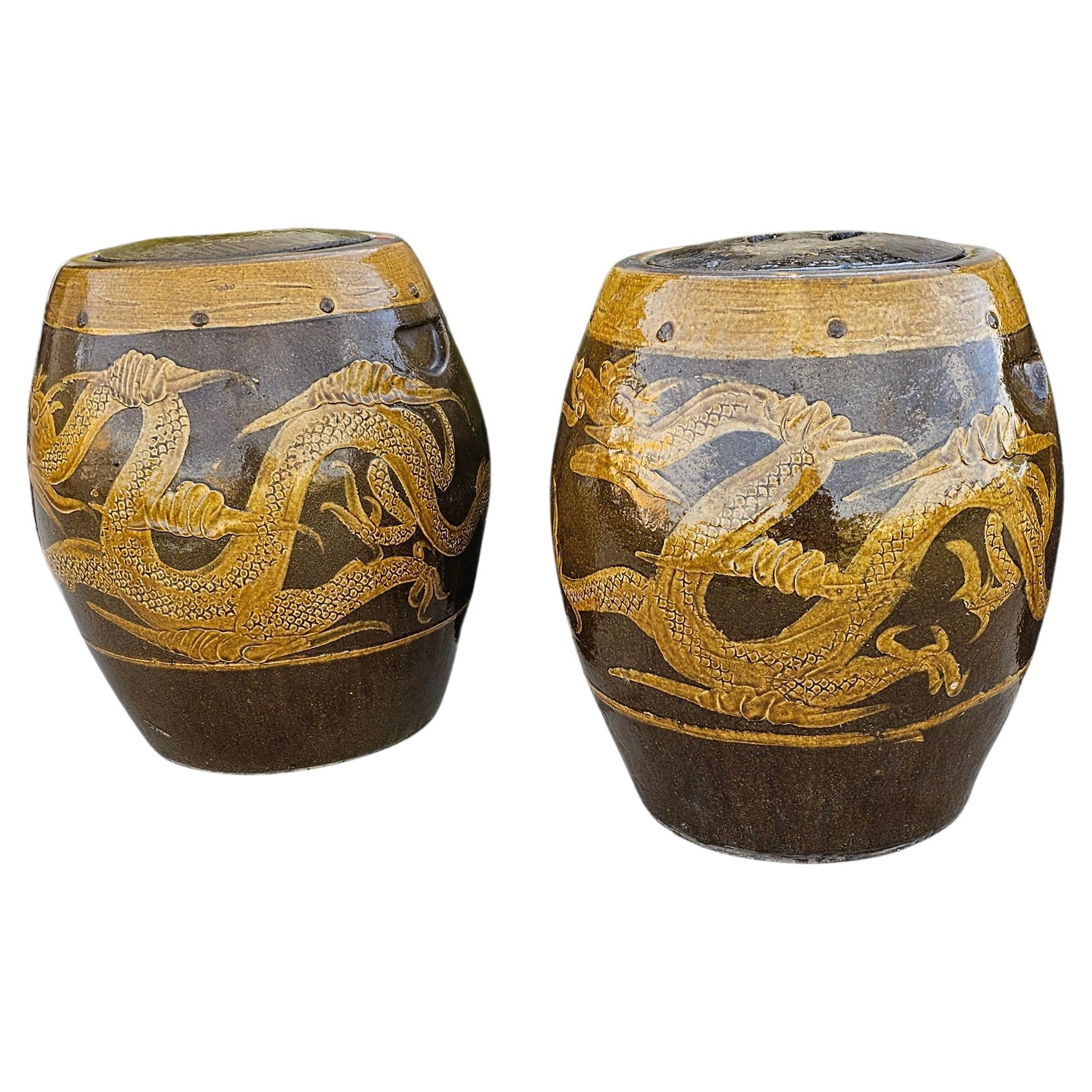 A large and most impressive pair of antique / vintage Chinese glazed earthenware covered Martaban storage jars, having sand and ochre brown glaze palette, incised with auspicious mythical dragon and Fènghuáng phoenix bird encircling the body, carved