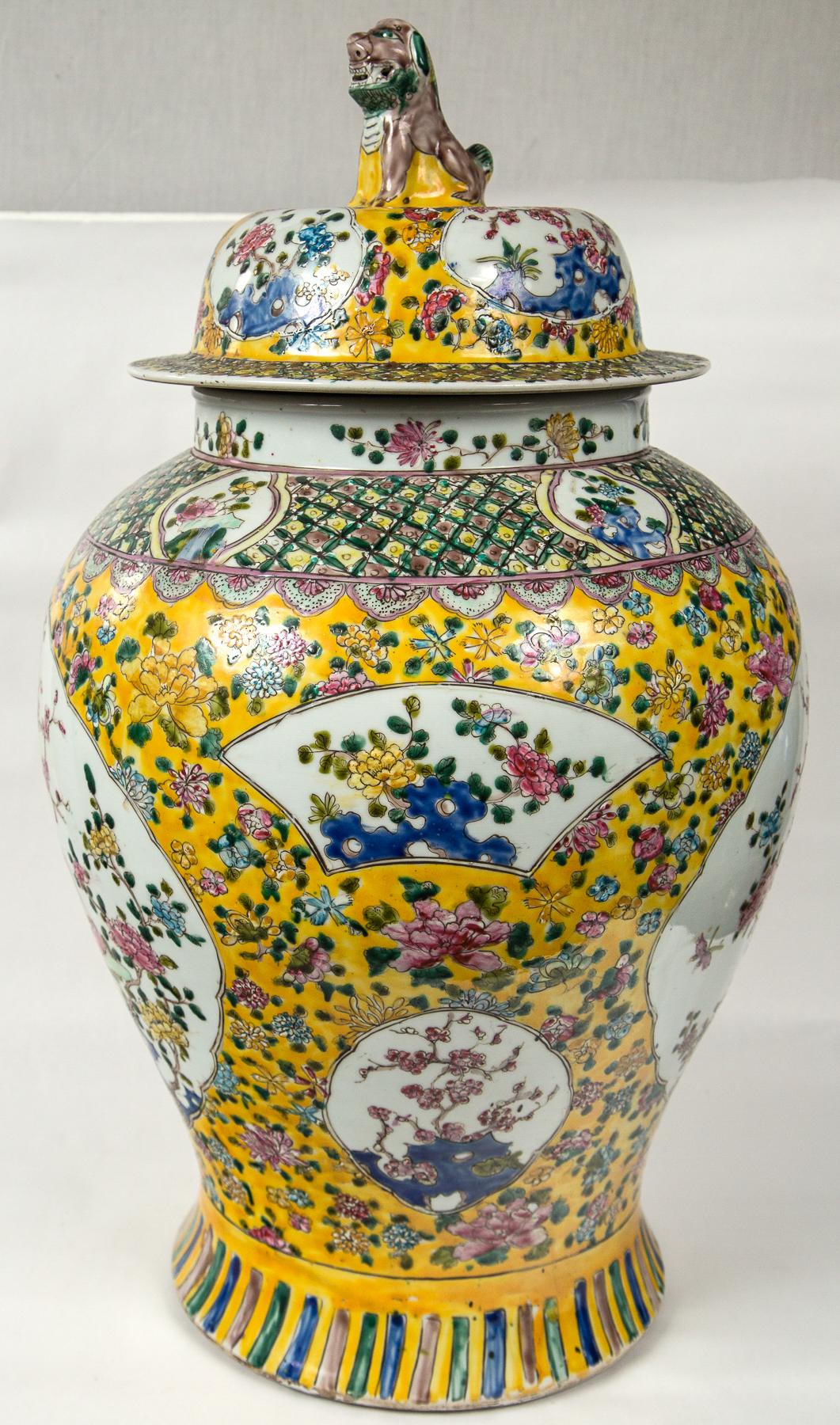 Yellow ground, hand painted patterns and designs
foo dog form finial atop lids.