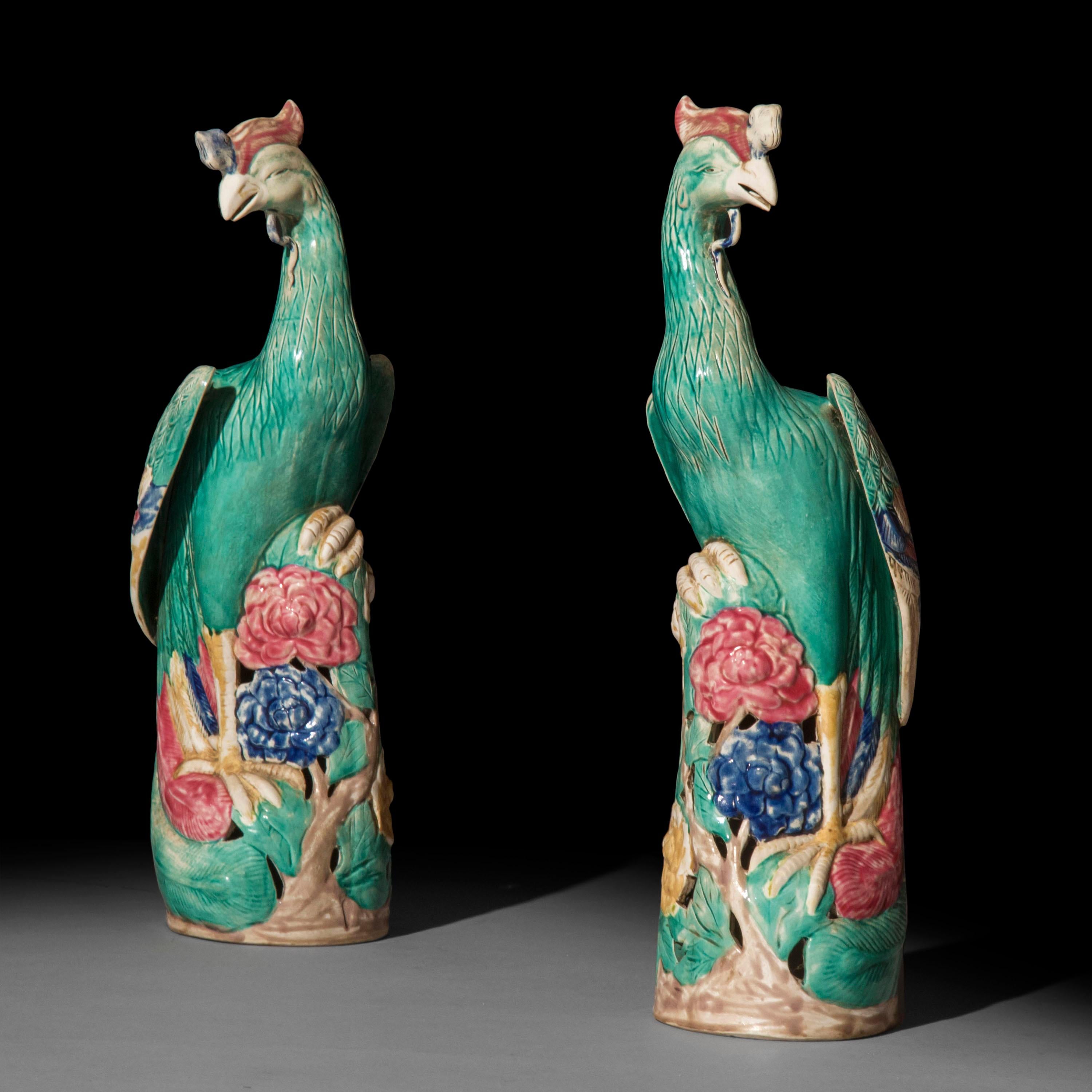 A charming pair of Chinese Export phoenix porcelain figurines, polychrome decorated.

China, 20th century.

Size: Height 41 cm / 16 inches.
 