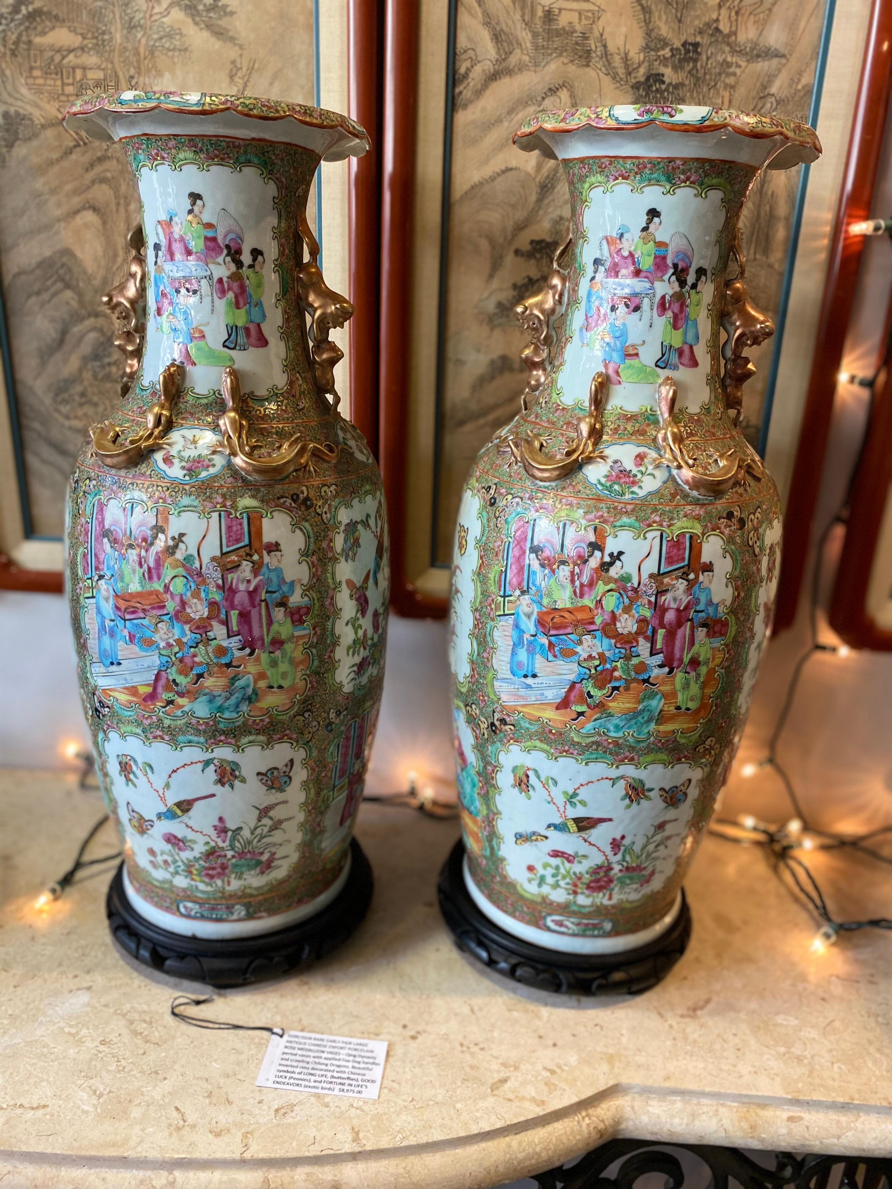 This large pair of Rose Medallion Cantonese Porcelain Vases are very special excellent quality depicting family life, birds and butterflies, The colors are correct for being early 1800s note the gold gilt in the ladies black hair (one of the
