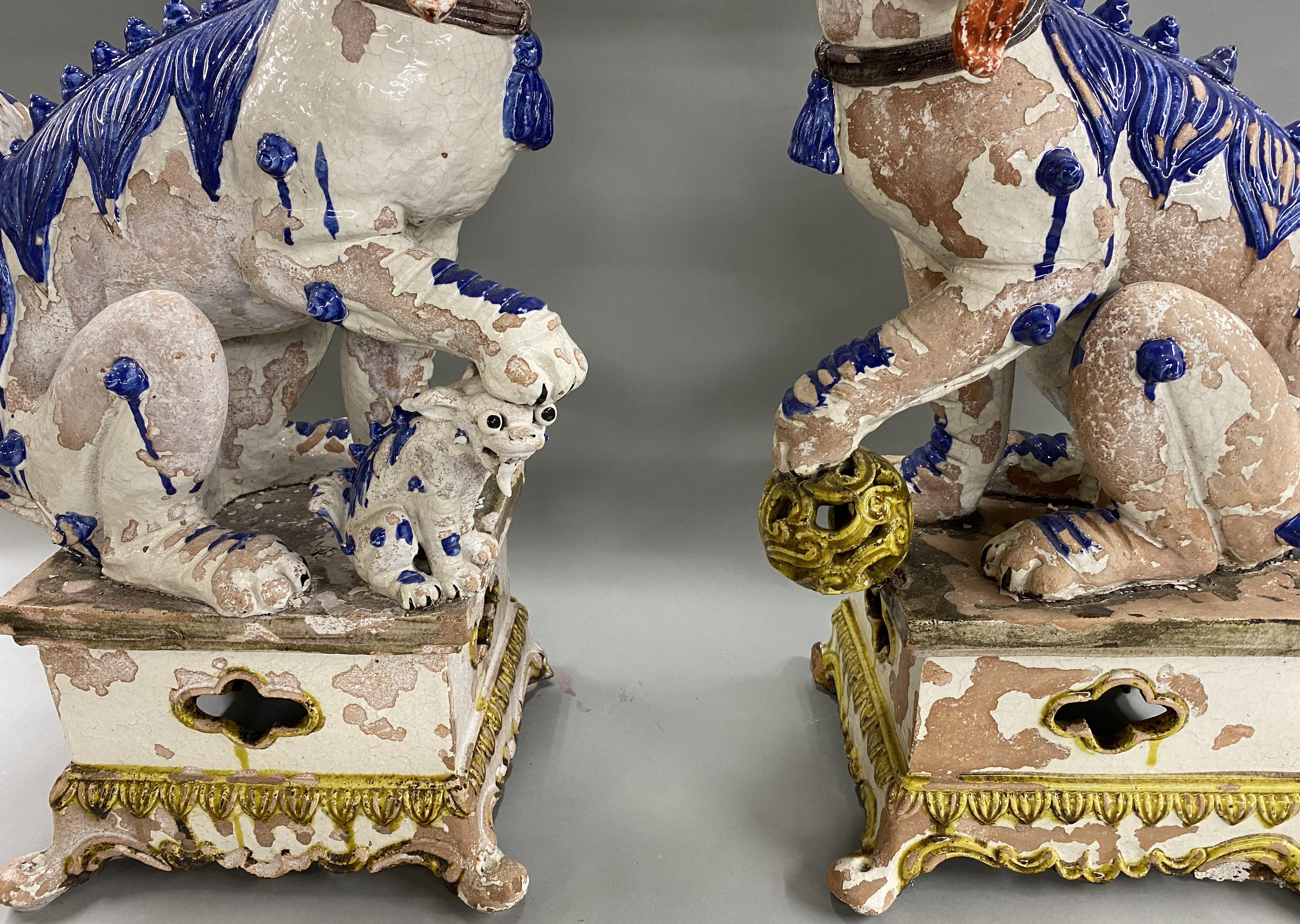 Large Pair of Chinese Tin Glazed Earthenware Foo Dogs with Ball & Pup Under Paws In Good Condition In Milford, NH
