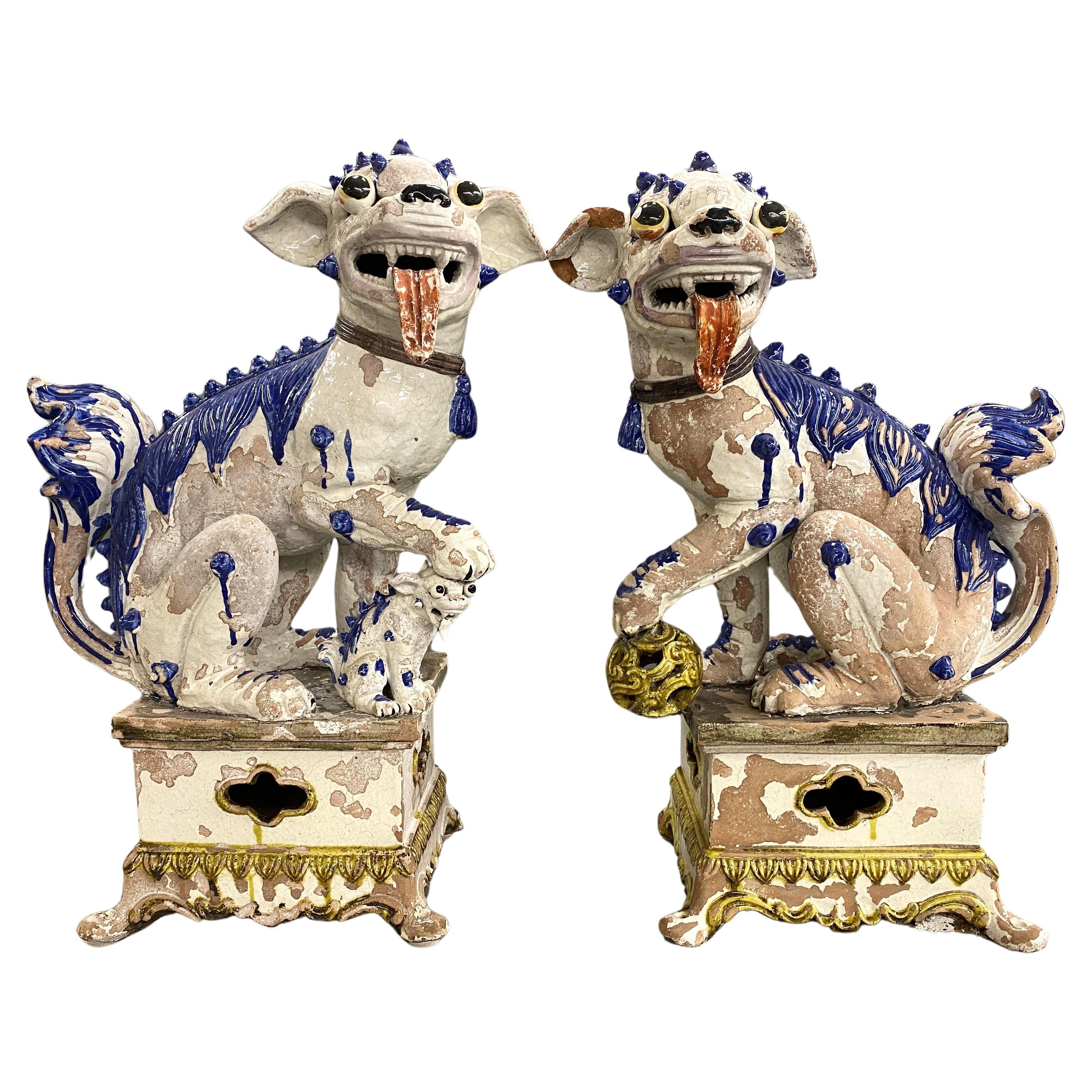 Large Pair of Chinese Tin Glazed Earthenware Foo Dogs with Ball & Pup Under Paws