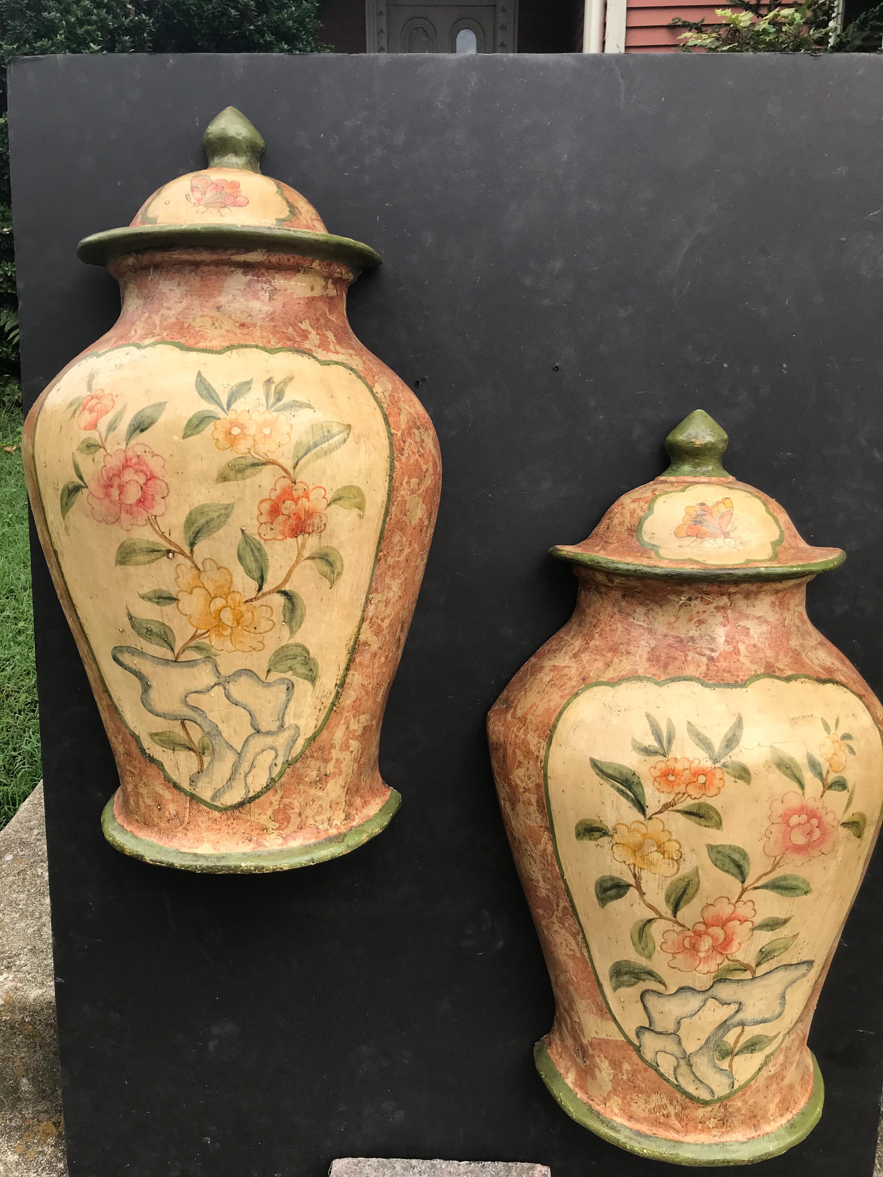 Provenance Parish-Hadley ( commissioned project ). With faux marble design encasing chinoiserie design floral display. 
The lids painted with butterflies. Half urns for wall mount or table and chest top. Almost two feet tall, a smidgen shy of 23
