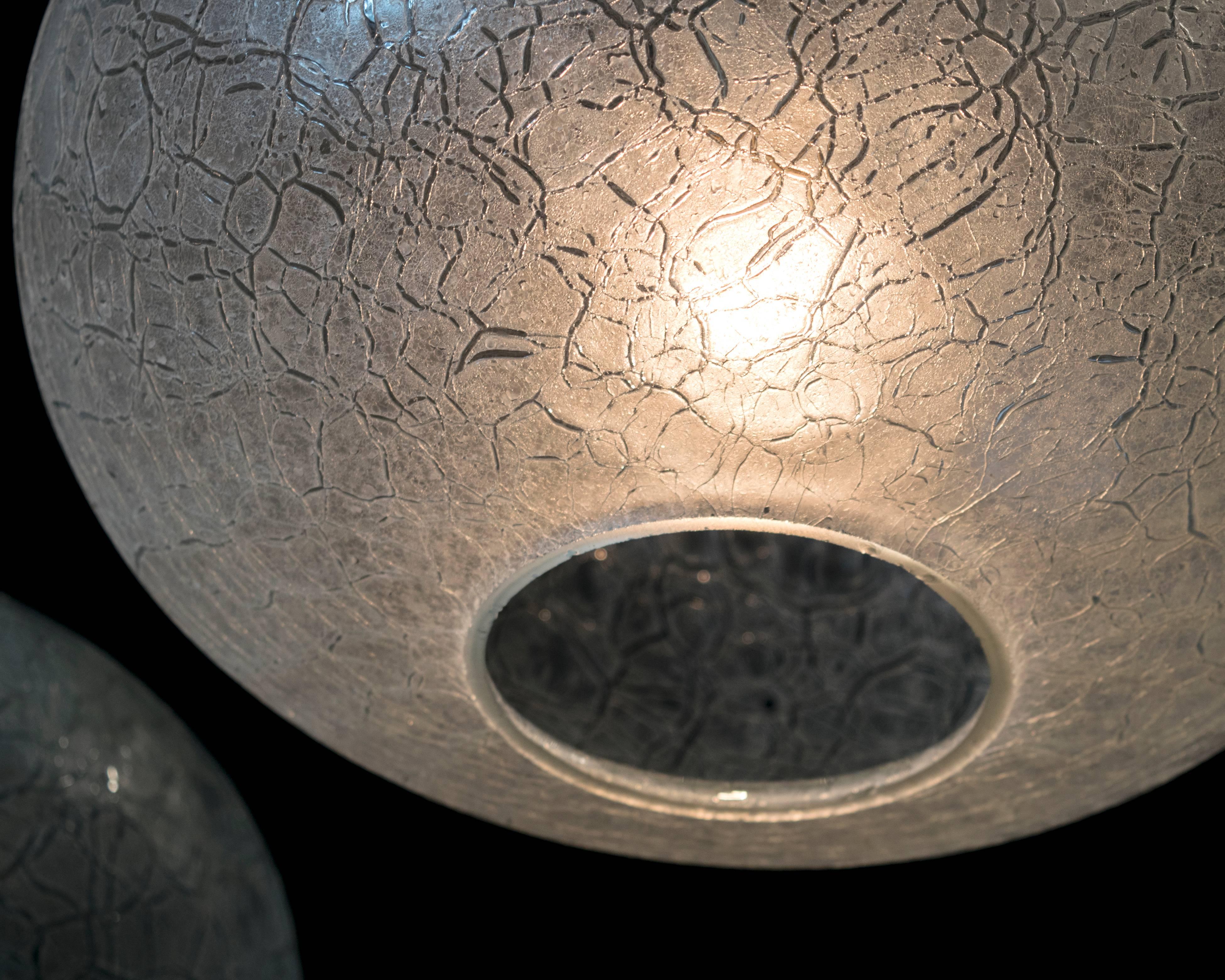 An excellent pair of Doria frosted crackled glass pendant lights. Height can be adjustable.