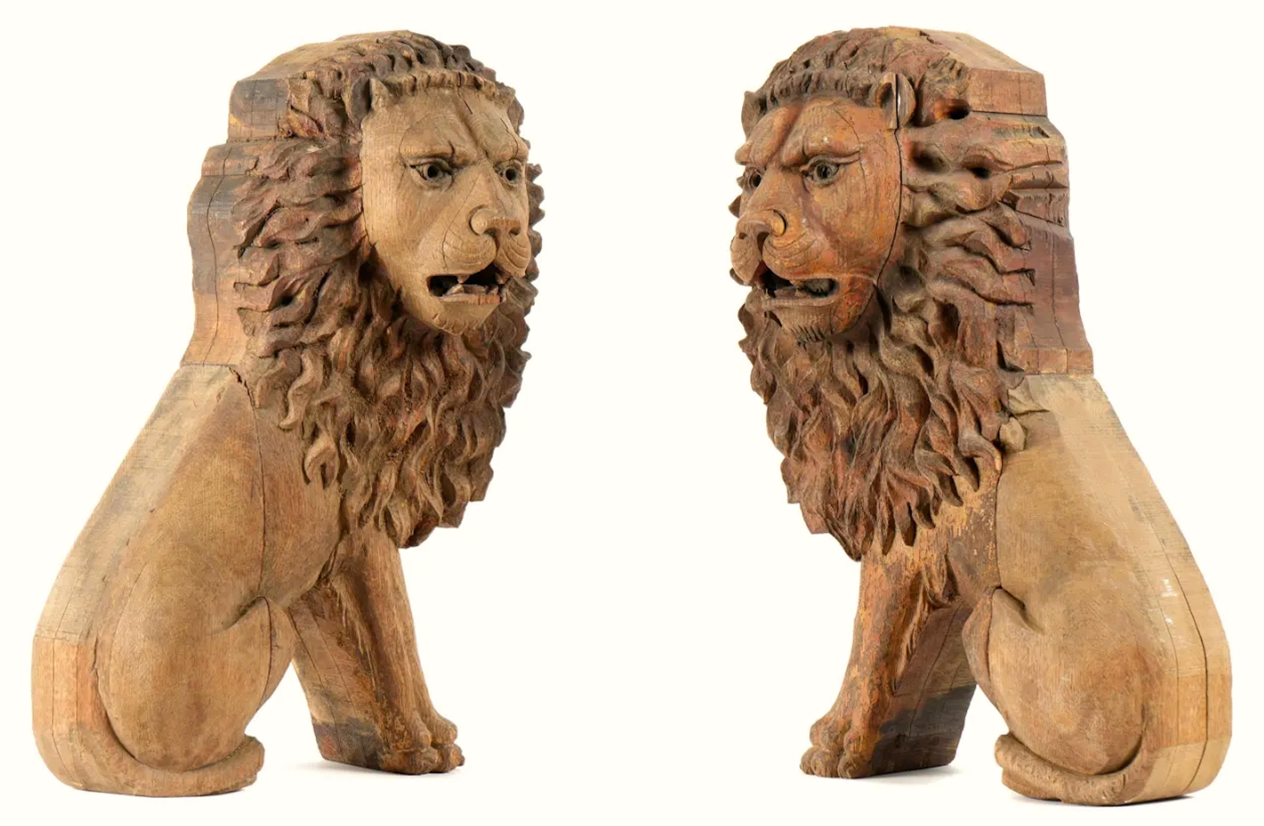 Fantastic folk art appeal in this well proportioned wood carved lions.  There are remnants of yellow and red paint and some gilt.  These most likely date to the early 19th century and are probably European, although they did come out of an American