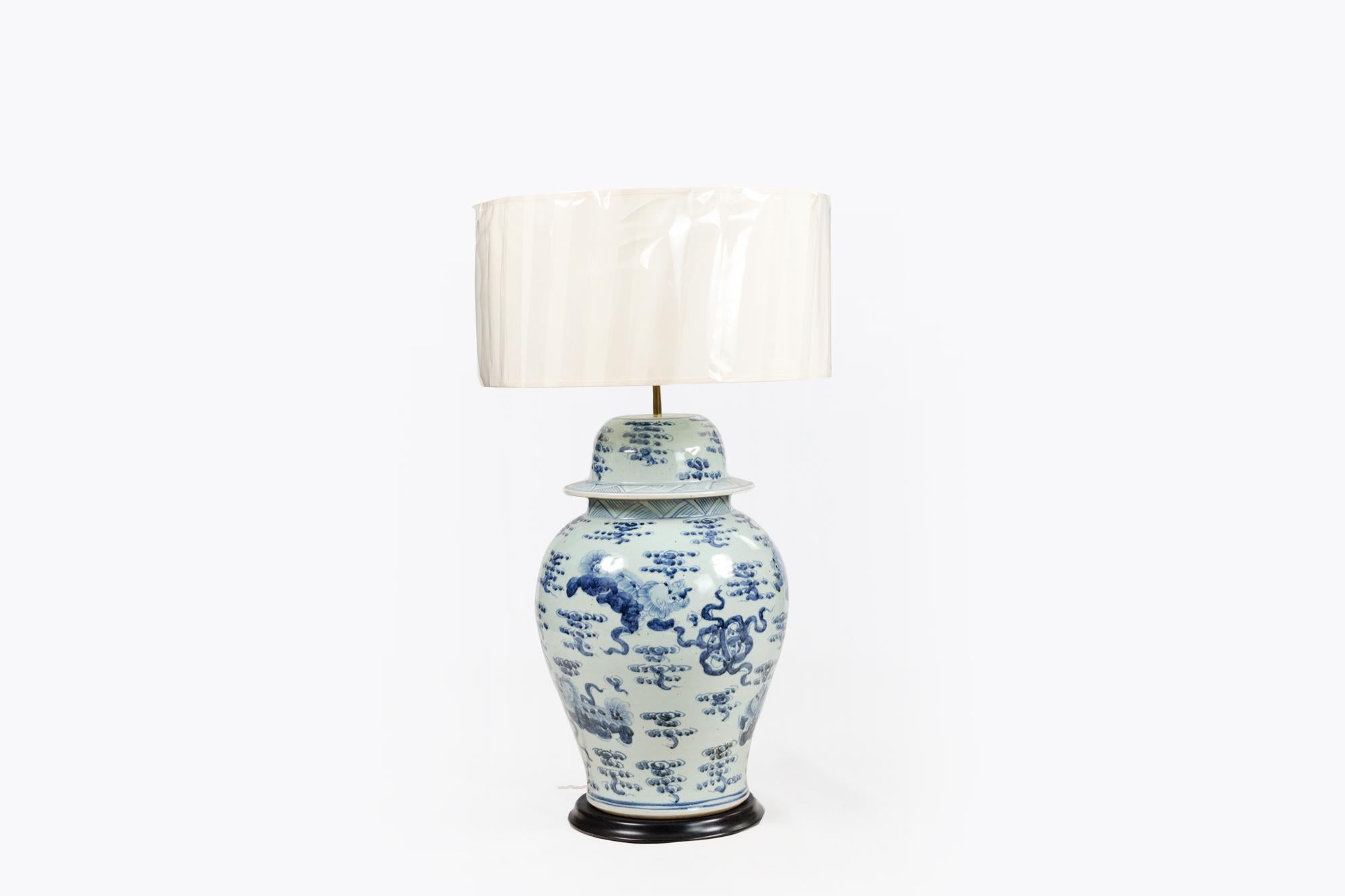 A large pair of early 20th century blue and white ginger jars converted into lamps in the style of the Chinese period of the 18th Century.