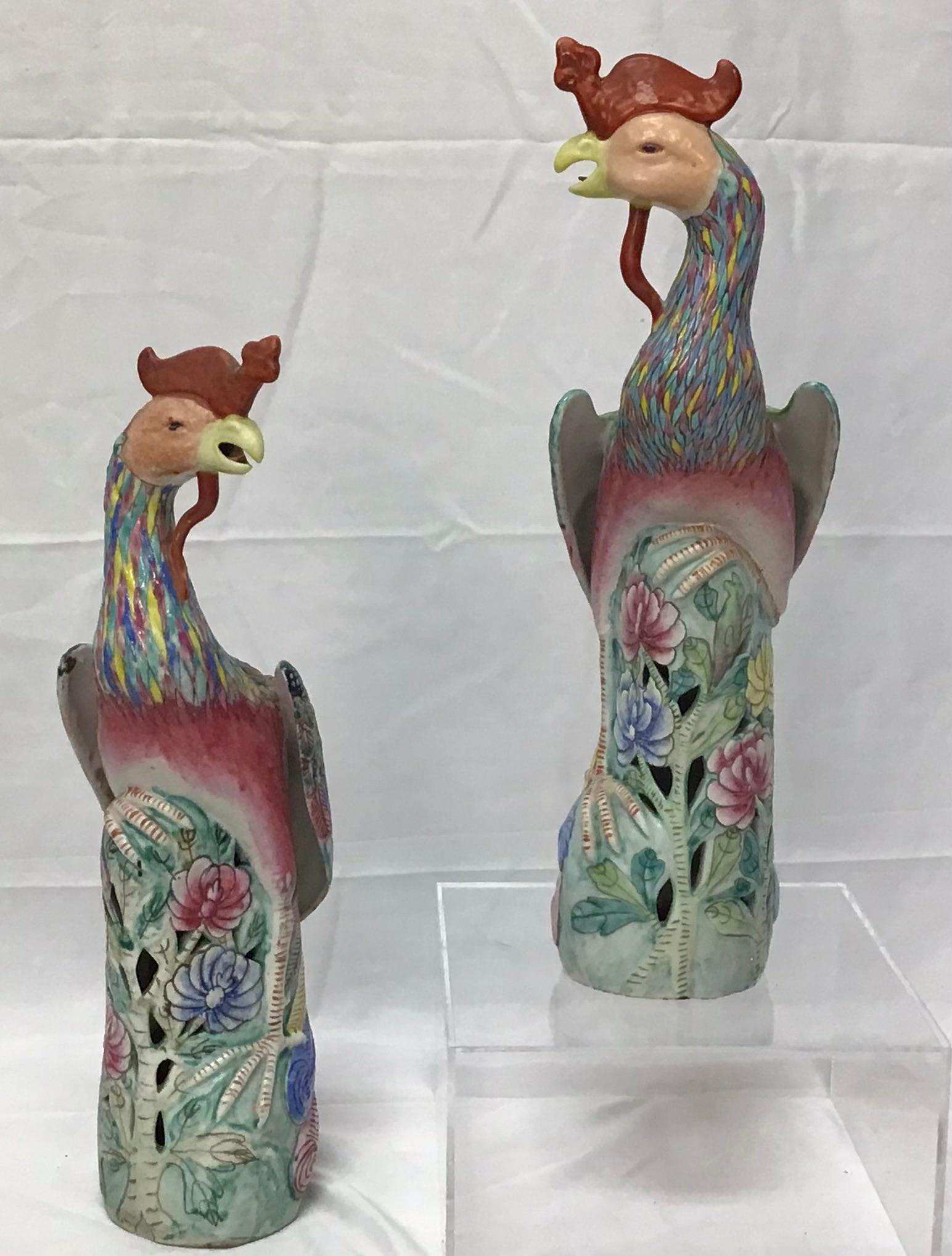 A wonderful pair of porcelain Chinese export models of roosters. A mirror-image pair of finely modeled porcelain roosters in polychrome glaze; each with great detail seen in their heads, eyes, combs and wattles; their finely-painted feathers in a