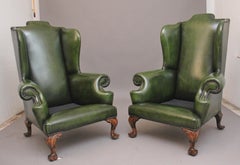 Large pair of early 20th Century walnut wingback armchairs