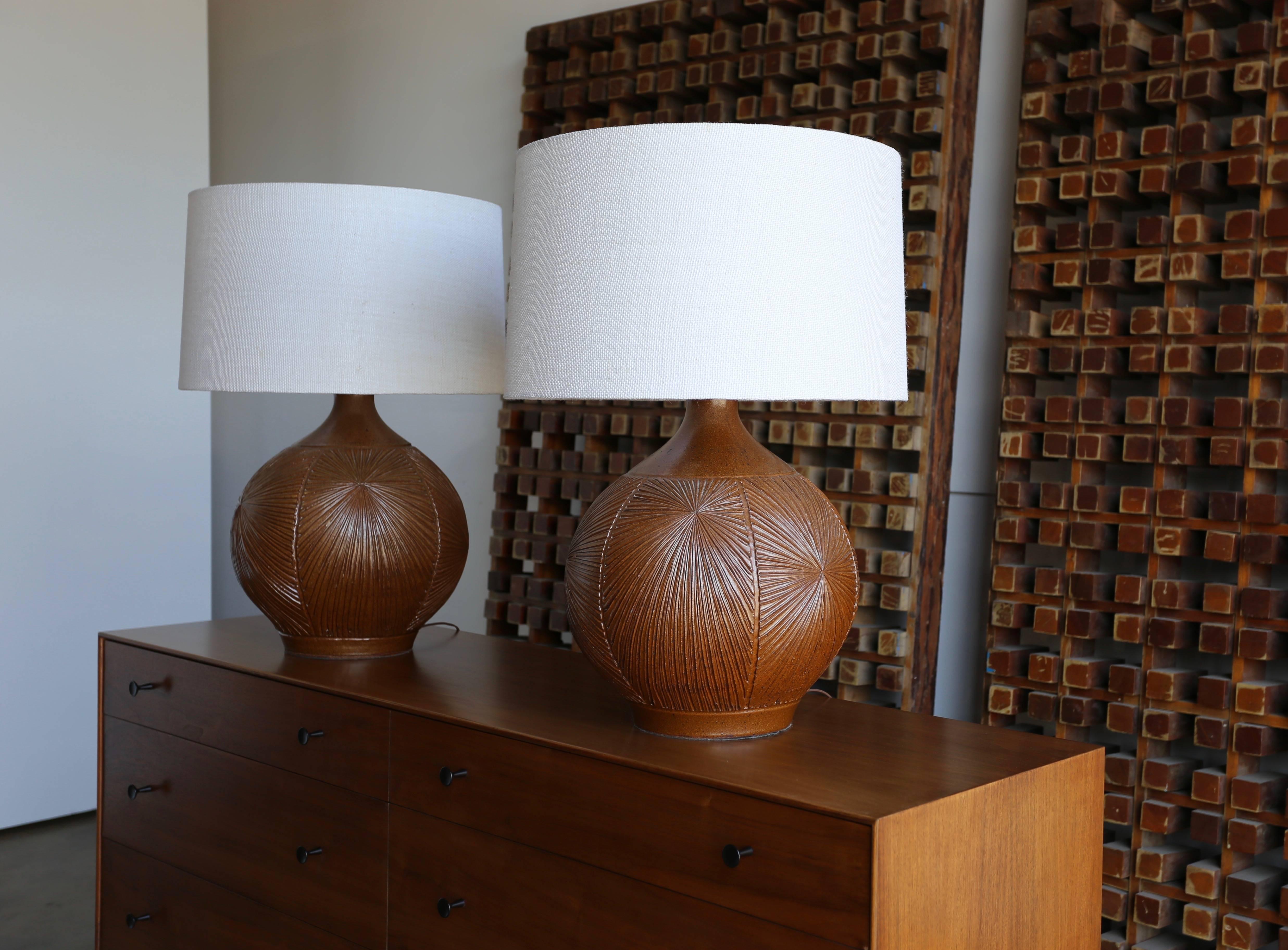 Large pair of ceramic earthgender table lamps by David Cressey Robert Maxwell. New custom shades. The listed measurements include the shades. This pair is a great example of California modern design.