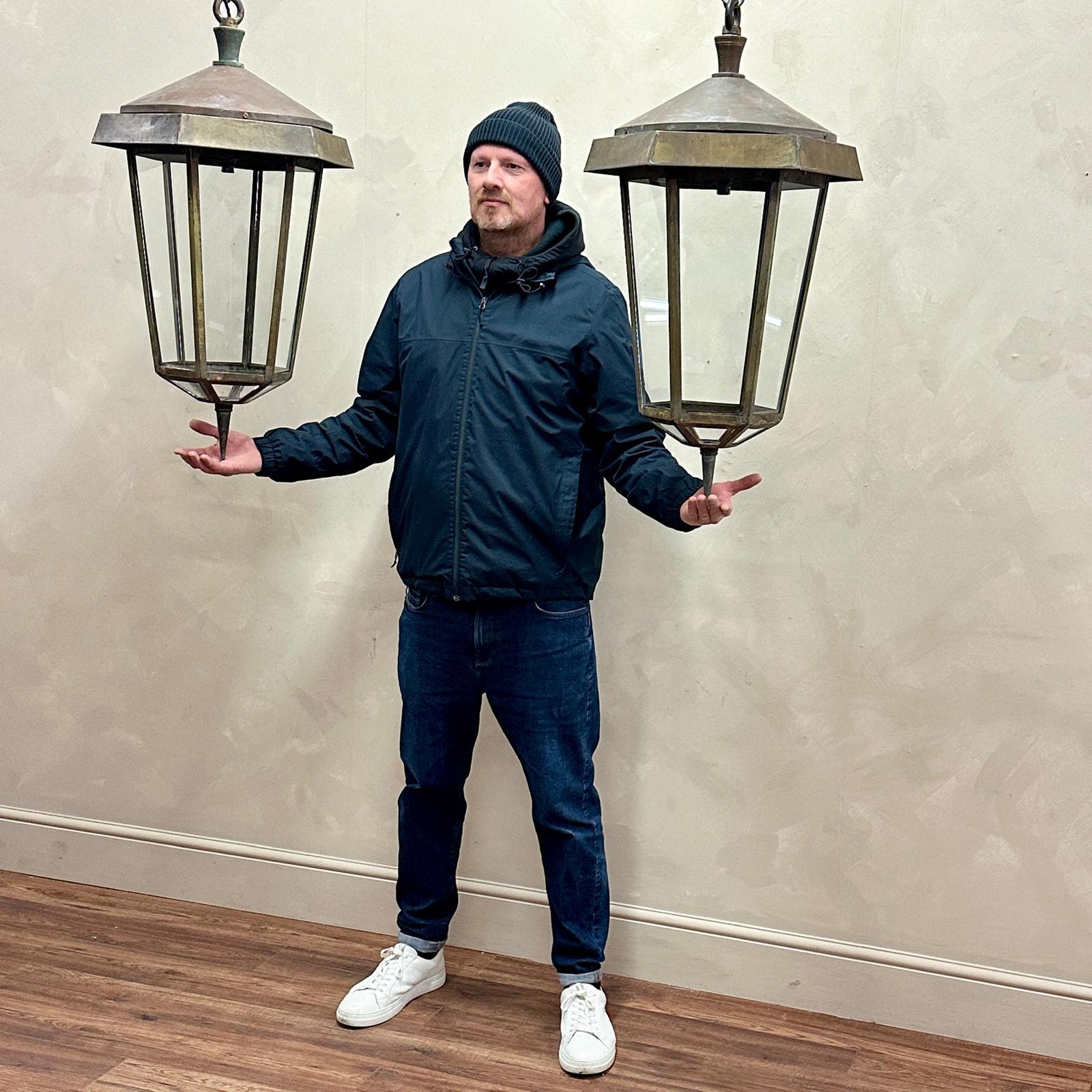 Huge pair of brass lanterns , 6 sided with glazed bottom panels .
These were originally hung either side of an amazing house in Wales , we also have another that was hung in the porch thats less weathered .
These are used to this day in the Tineside