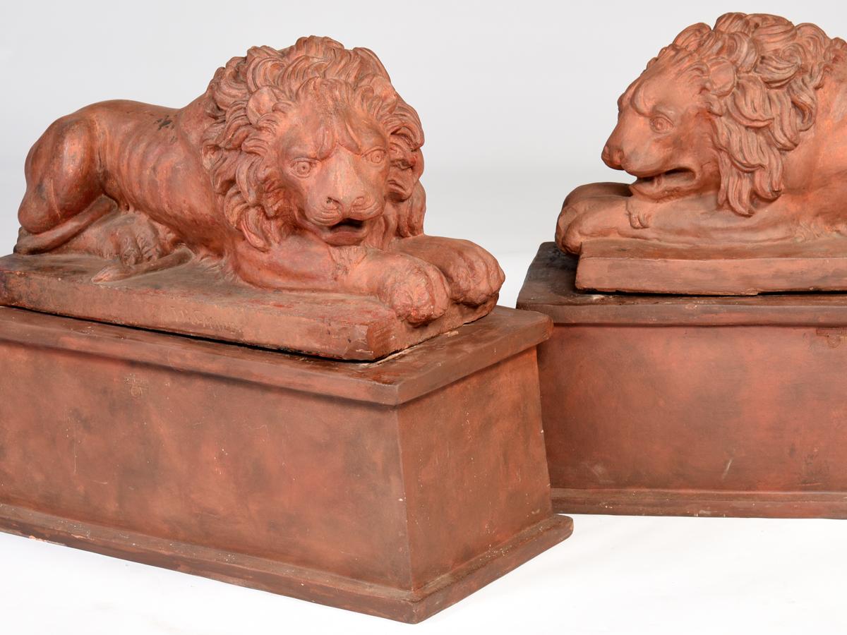 Cast Large Pair of English Terracotta Recumbent Lions on Later Bases, circa 1830 For Sale