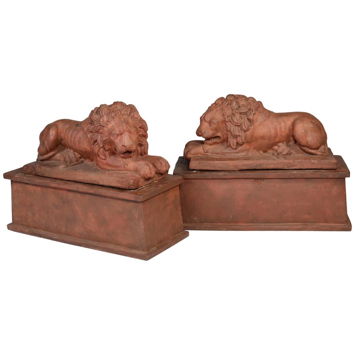 Large Pair of English Terracotta Recumbent Lions on Later Bases, circa 1830 For Sale