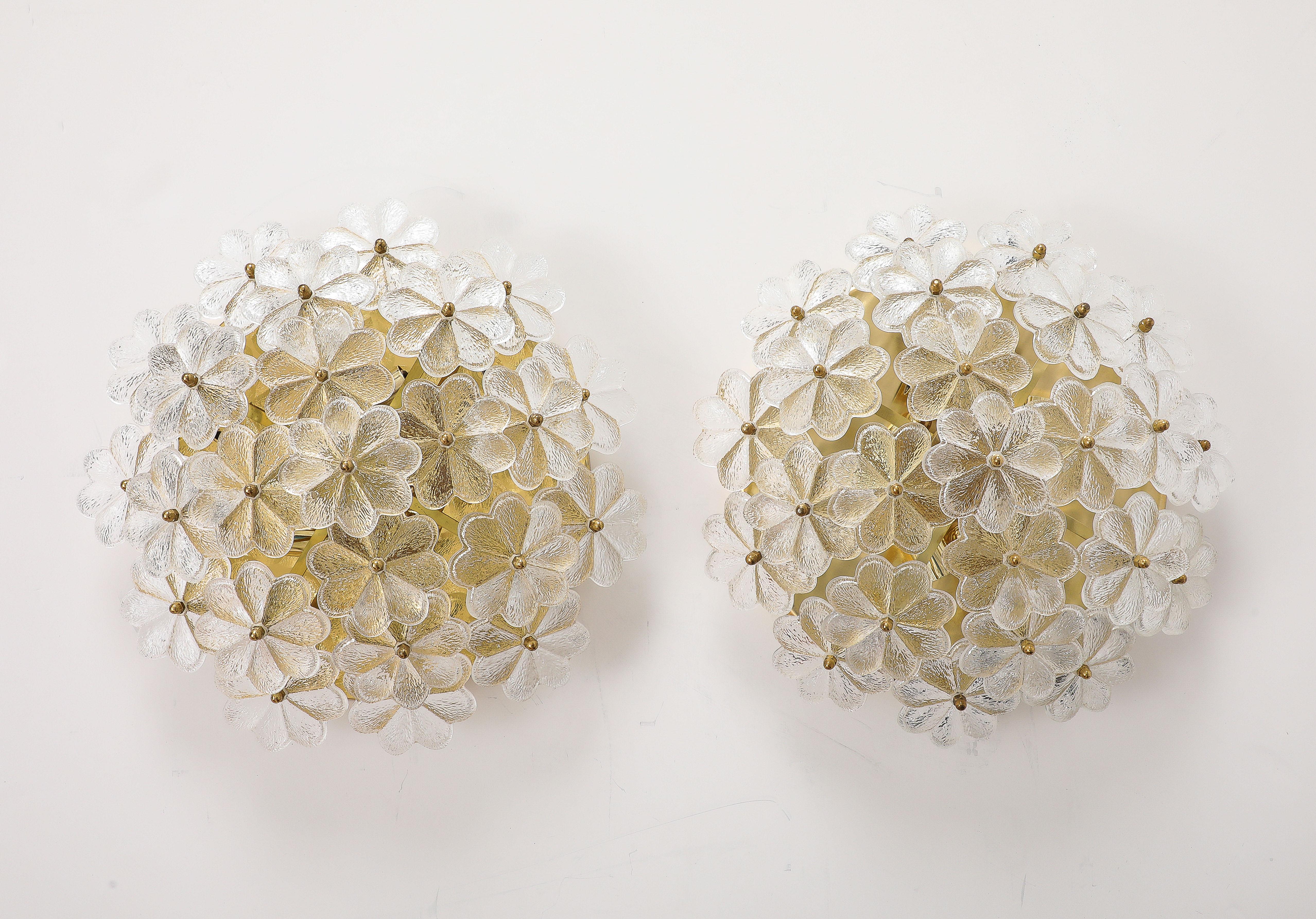 Wonderful pair of  large  Mid - Century Modern Murano glass flora flush mounts / Sconces
 by Ernst Palme.
The Newly polished brass bases each hold 27 Murano glass flowers that are beautifully illuminated by five candelabra lights that have been