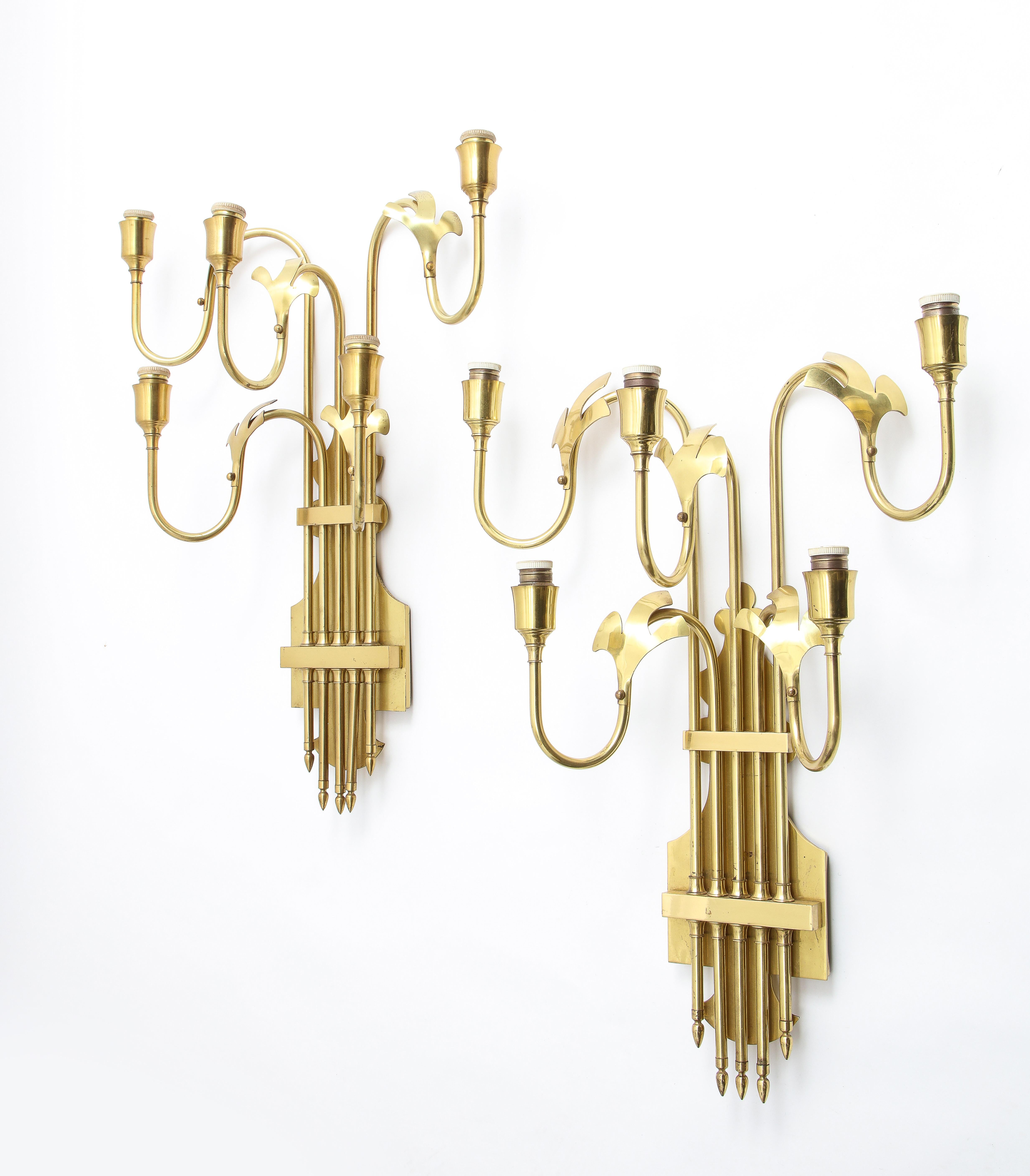 Large and dramatic pair of sconces in brass with 5 lights and stylized petal decoration. Rewired.