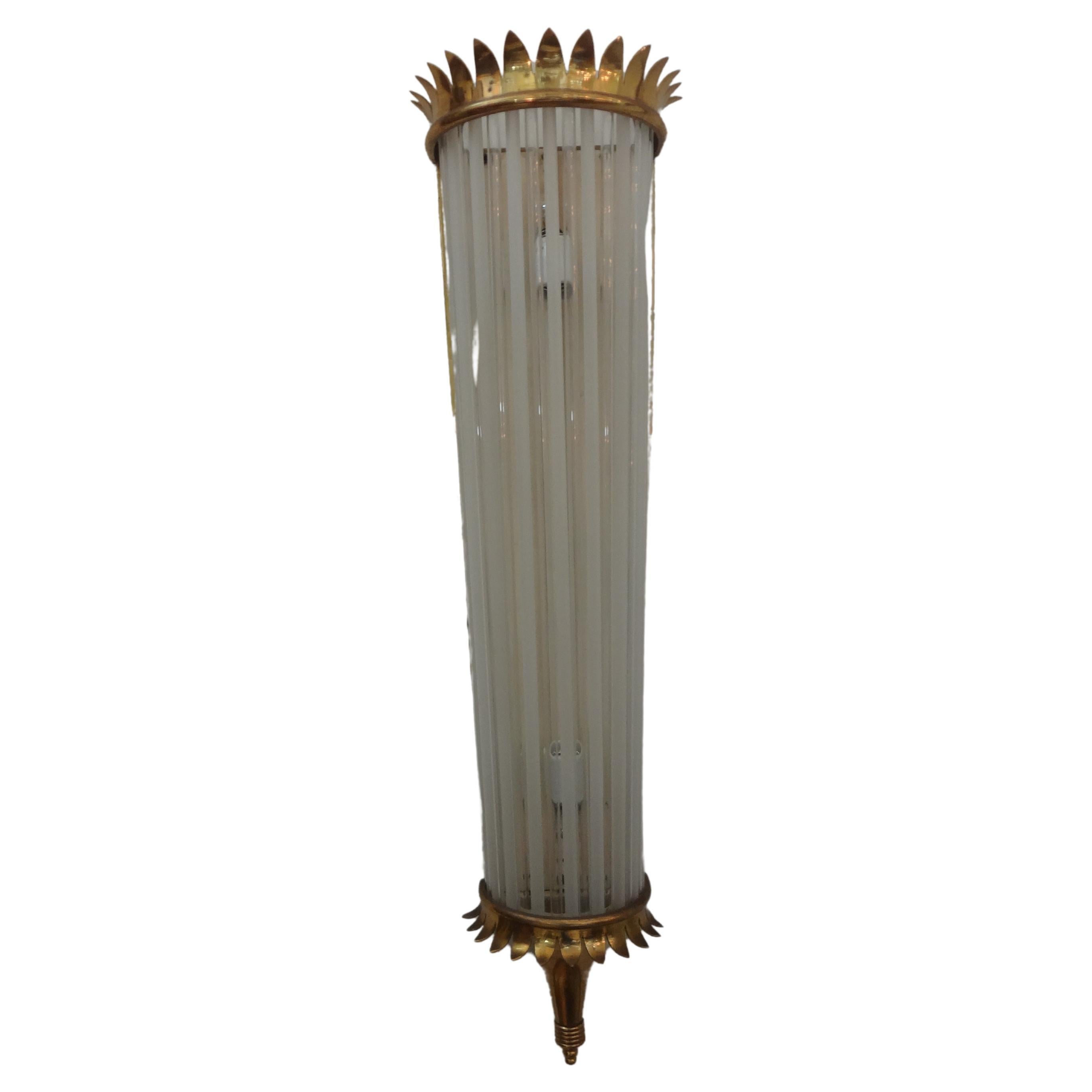 Outstanding Large Pair Of French Art Deco Brass And Glass Sconces.
We offer a magnificent pair of French Art Deco brass sconces with alternating clear and frosted glass rods. Our large scale French sconces have been newly wired each having 2 Edison