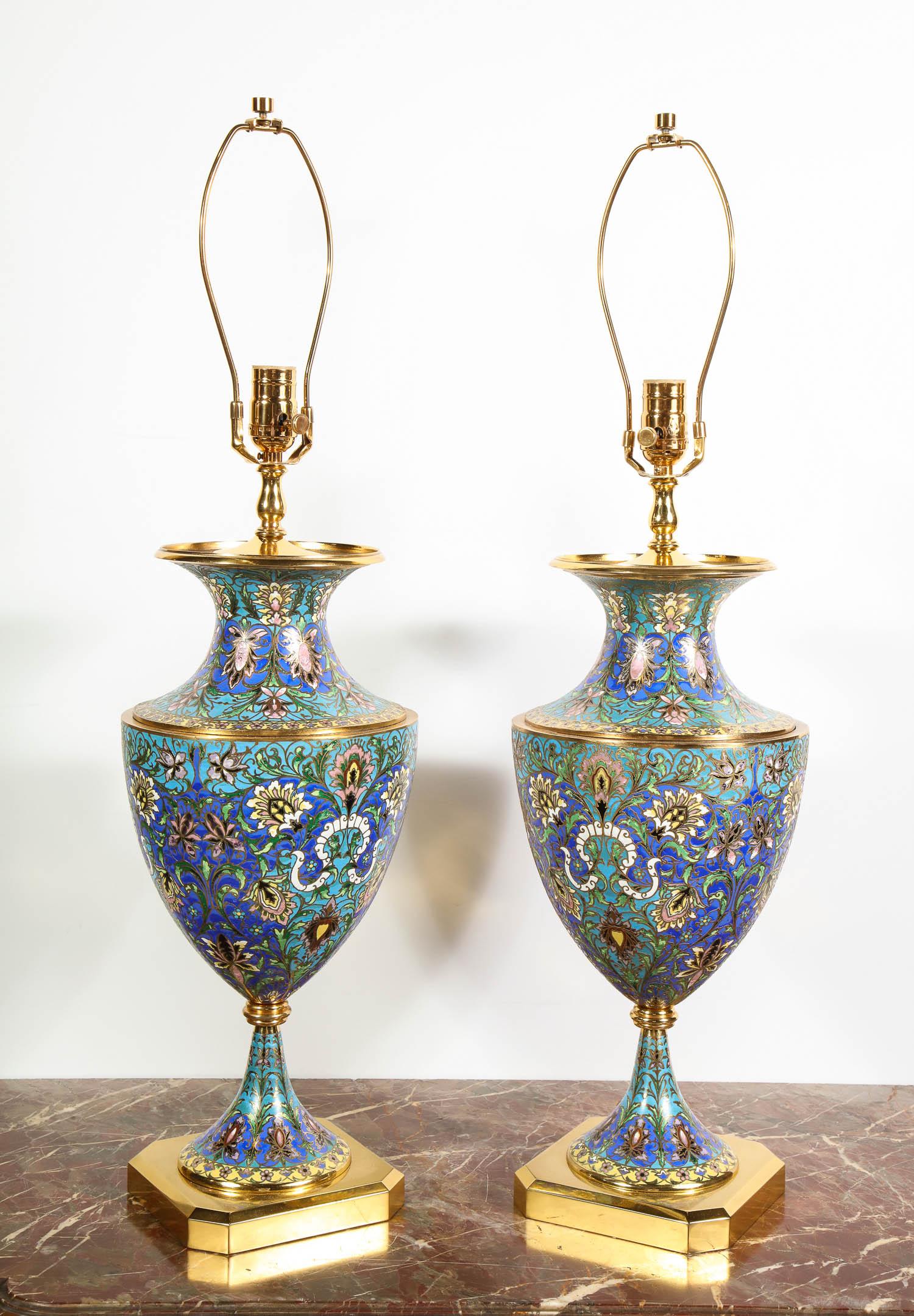 A large pair of French gilt bronze-mounted Champlevé / Cloisonné enamel table lamps,
circa 1910

Nicely enameled throughout. Can be used as lamps or vases. 

Good condition.

Overall - 32