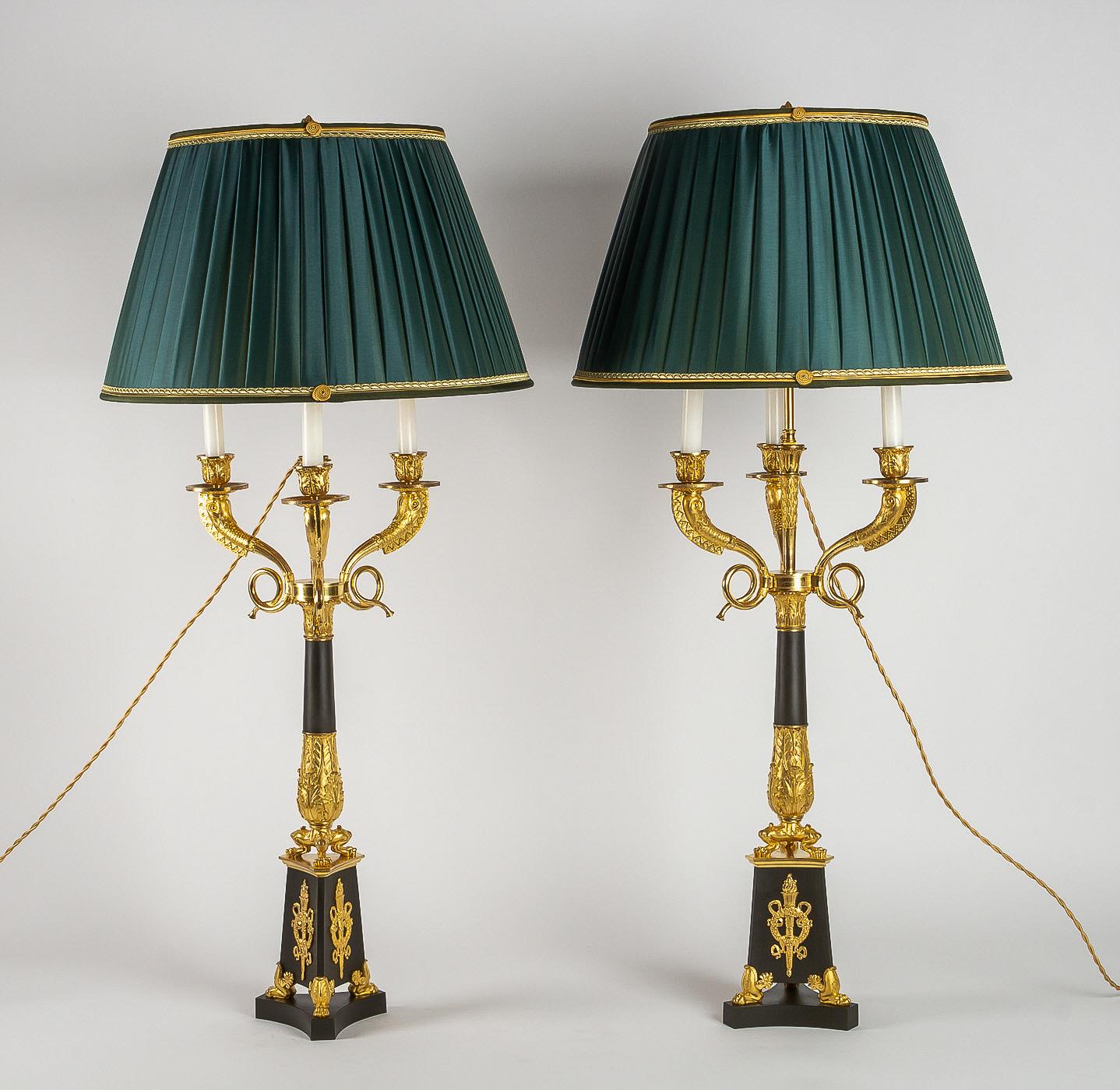 Large pair of French Restauration period candelabra converted in table lamps.

A magnificent and decorative large pair of three-light gilt bronze and patinated-bronze Restauration period candelabras, manufactured in the early 19th century, circa