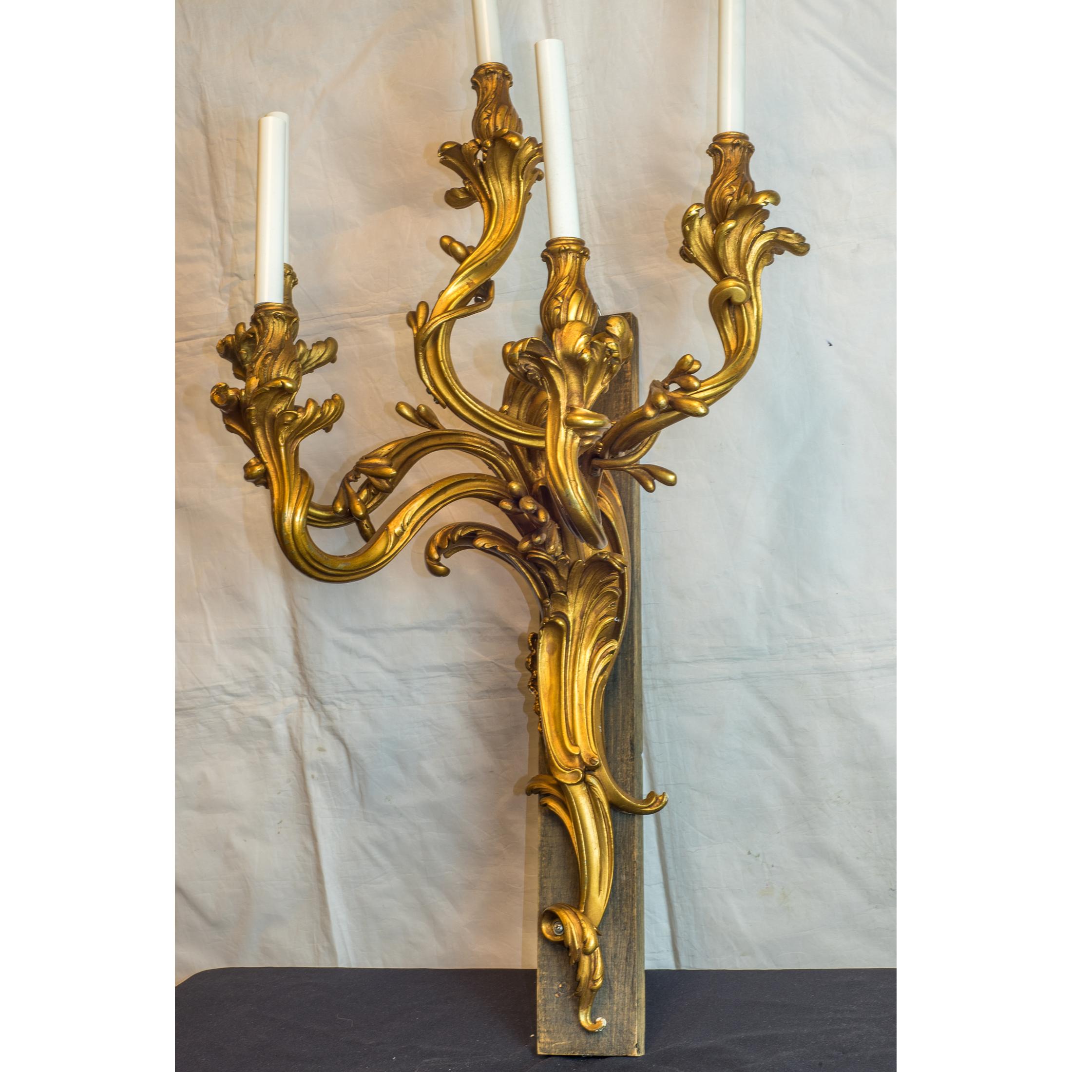 A large pair of French Rococo and Louis XV style five-light Ormolu sconces

Maker: Attrib. François Linke (1855-1946)
Origin: French
Date: 19th century
Dimension: 38 x 20 3/4 x 13 3/4 inches.