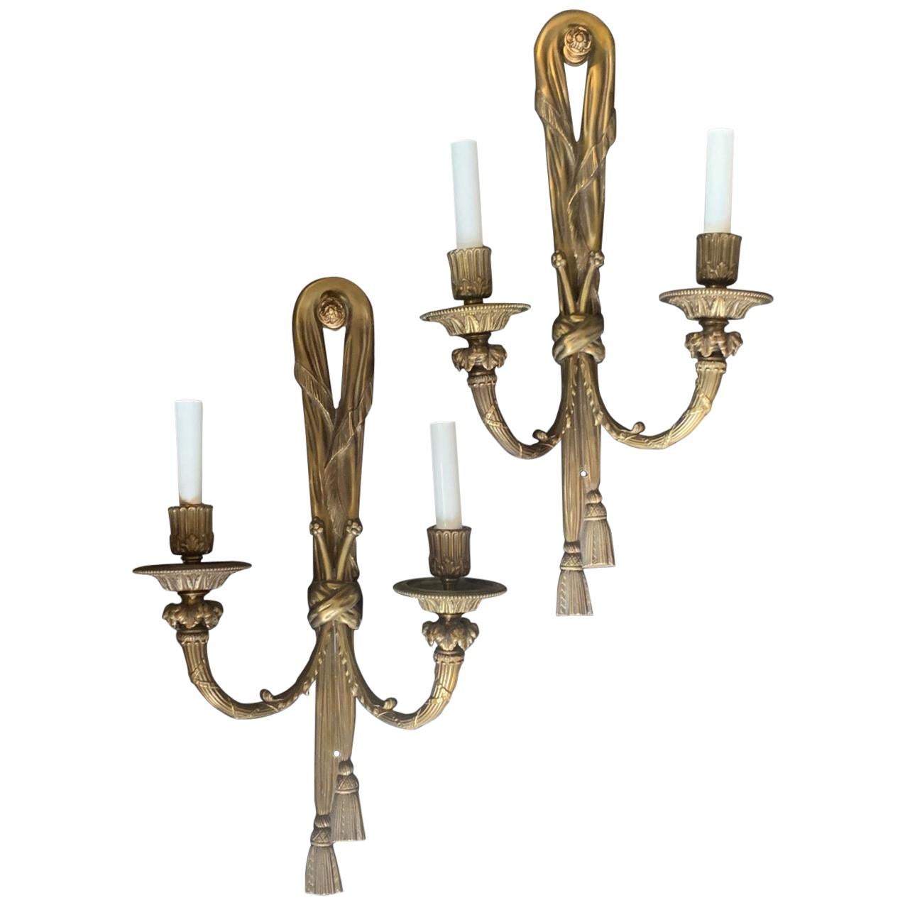 Large Pair of Gilt Bronze E.F. Caldwell Two-Light Ribbon Tassel Sconces For Sale