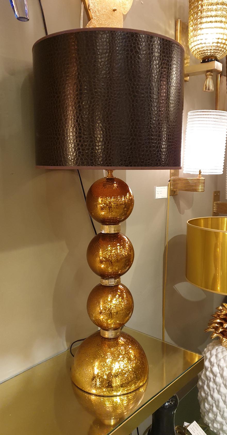 Pair of large gold mirrored Mid-Century Modern Murano glass table lamps, in the style of Mazzega, Italy, 1970s.
The handmade Pulegoso lamps have air bubbles inside the glass.
They have been rewired, with 1 medium base bulb each.
In excellent