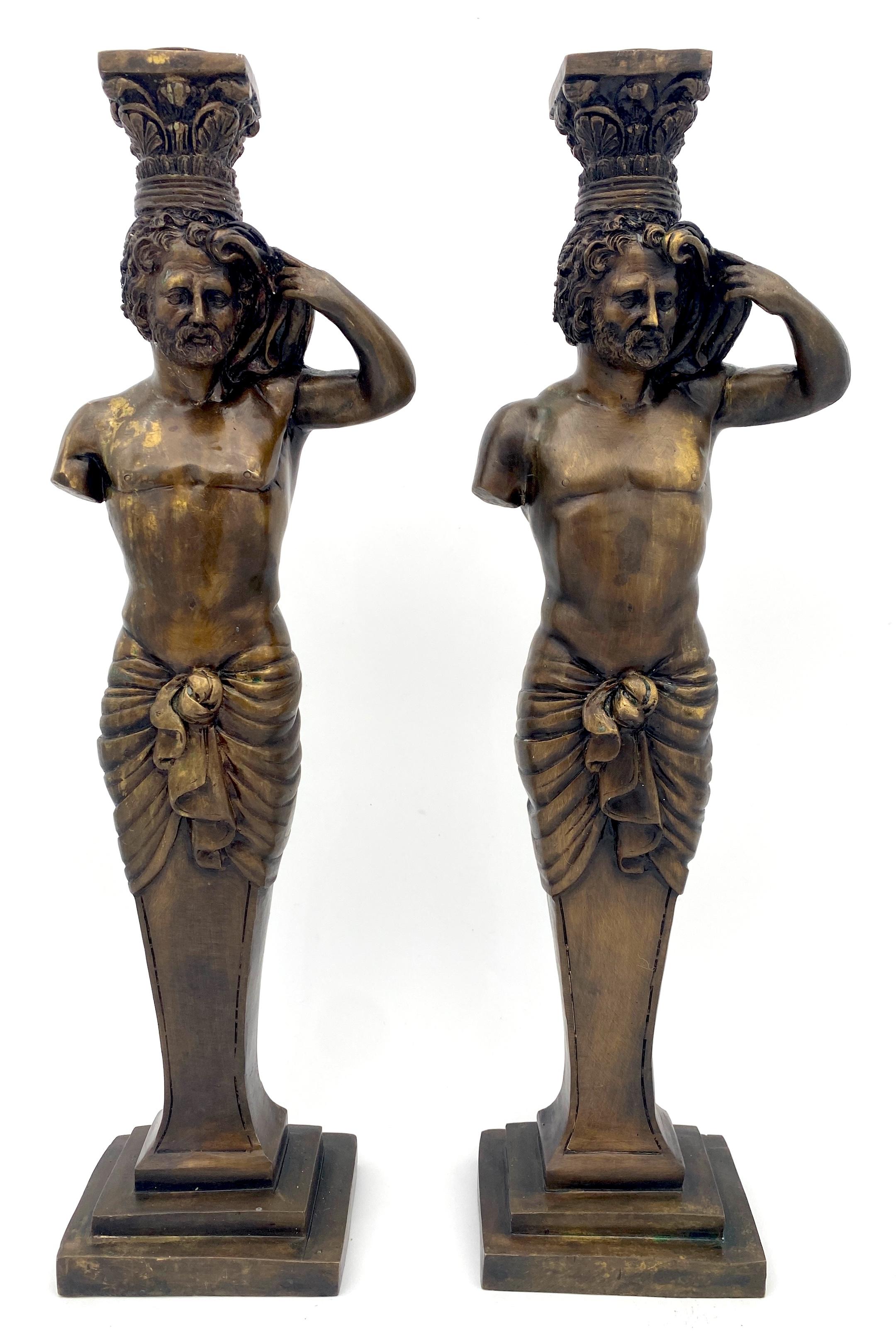 Pair of Grand Tour-Style Bronze Male Caryatid Column Candlesticks 
Italy, 20th century 

A large pair of architectural Grand Tour-style bronze male caryatid column candlesticks from Italy, made in the 20th century, Each candlestick stands 16 inches