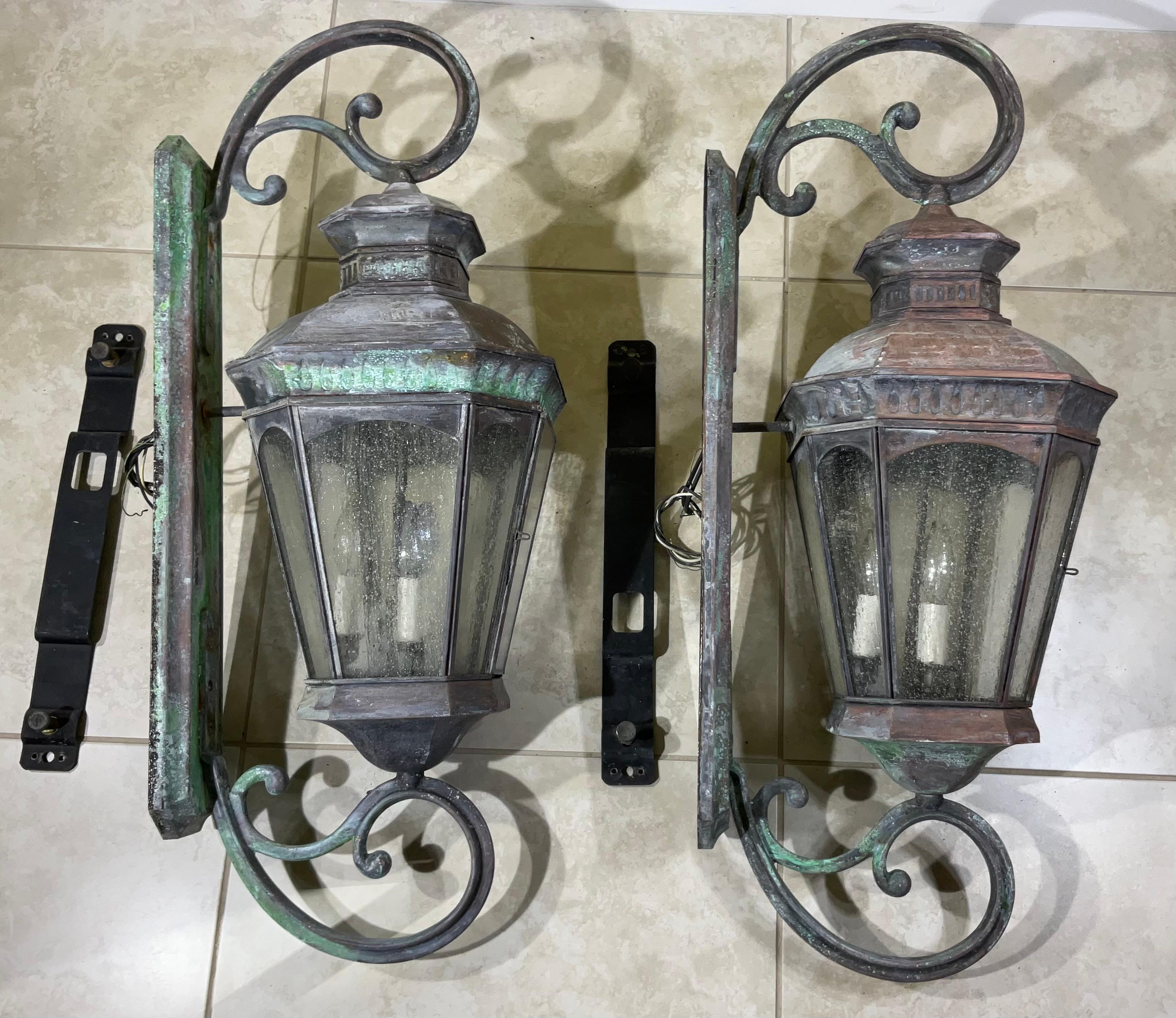 Exceptional large impressive pair of wall lantern made of solid brass, quality workmanship, electrified with three 40/watt light each, beautiful texture glass. Great light exposure.
Suitable for wet location.
Great patina decorative pair of lantern