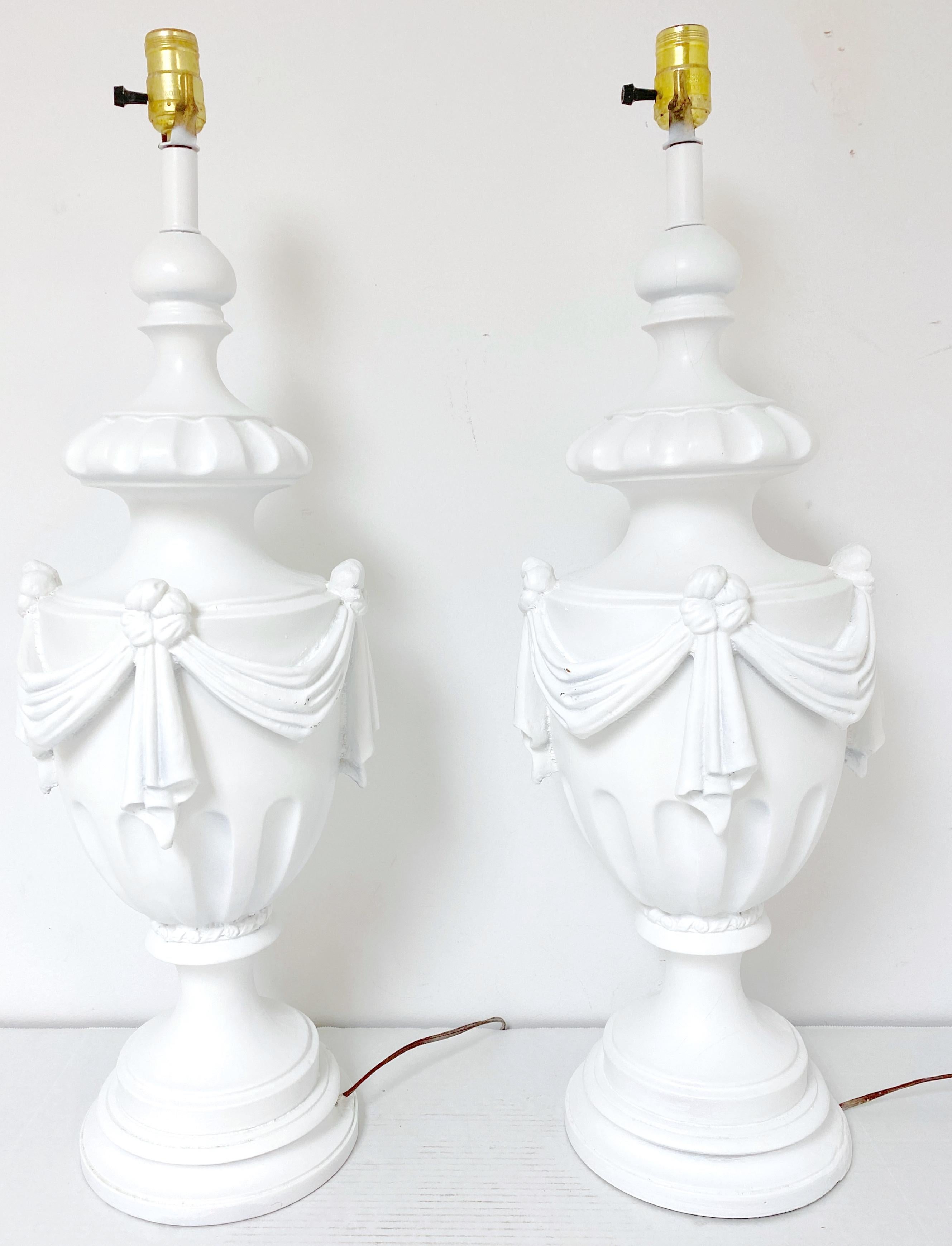 American Large Pair of Hollywood Regency Neoclassical White Lacquered Draped Urn Lamps For Sale
