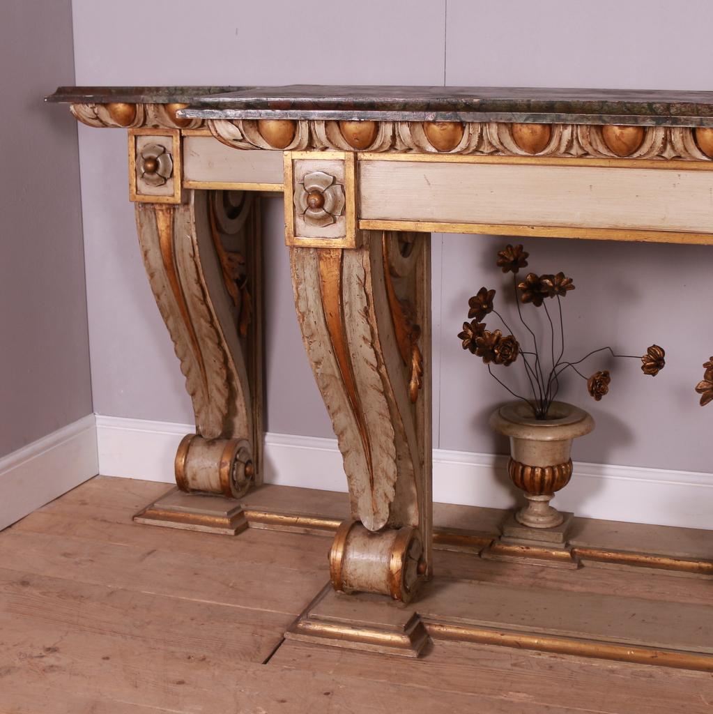 Large pair of 19th C Italian console tables with faux marble tops. 1880.

Dimensions
74 inches (188 cms) wide
20 inches (51 cms) deep
42.5 inches (108 cms) high.